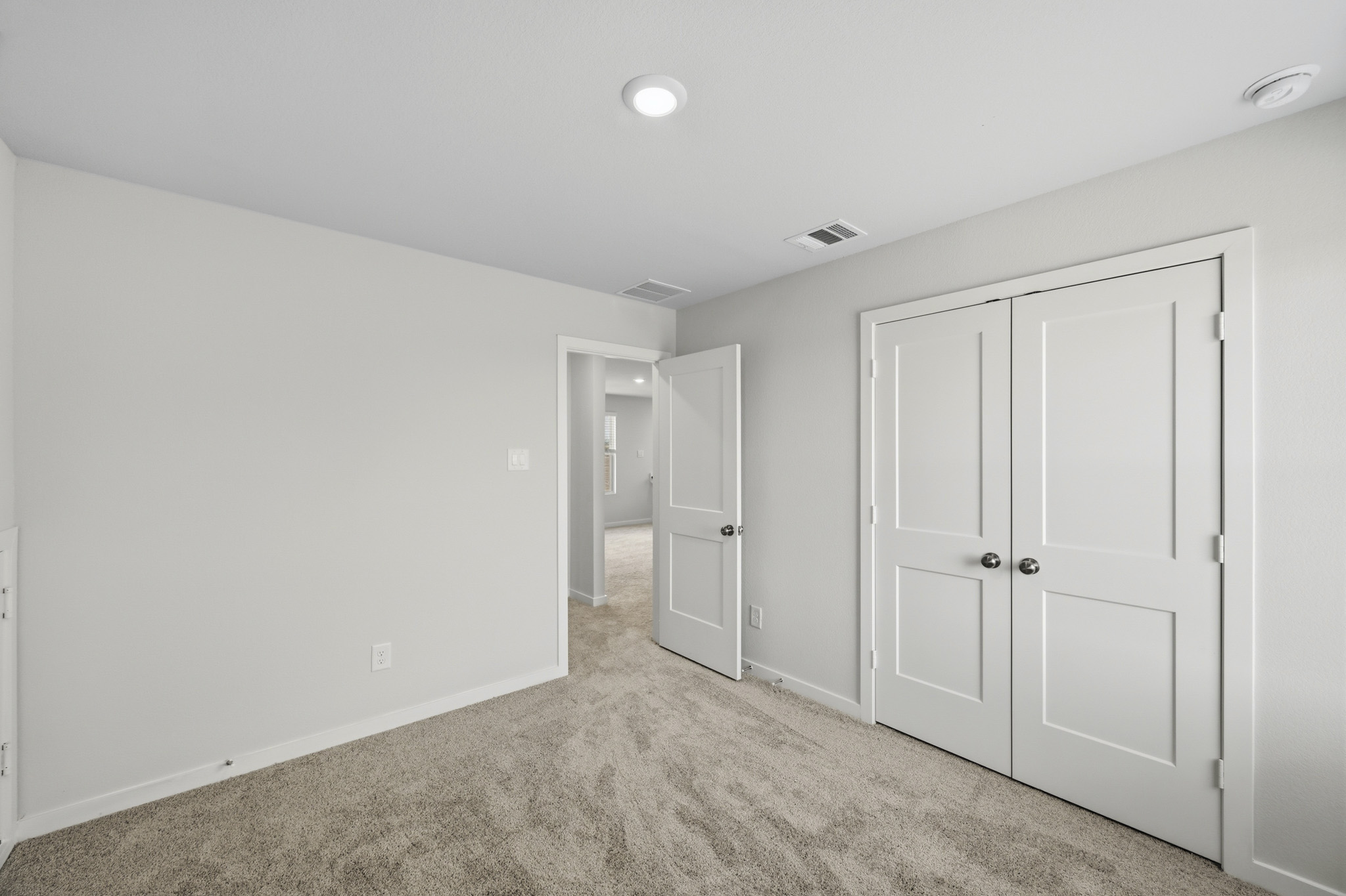 A room with white doors.