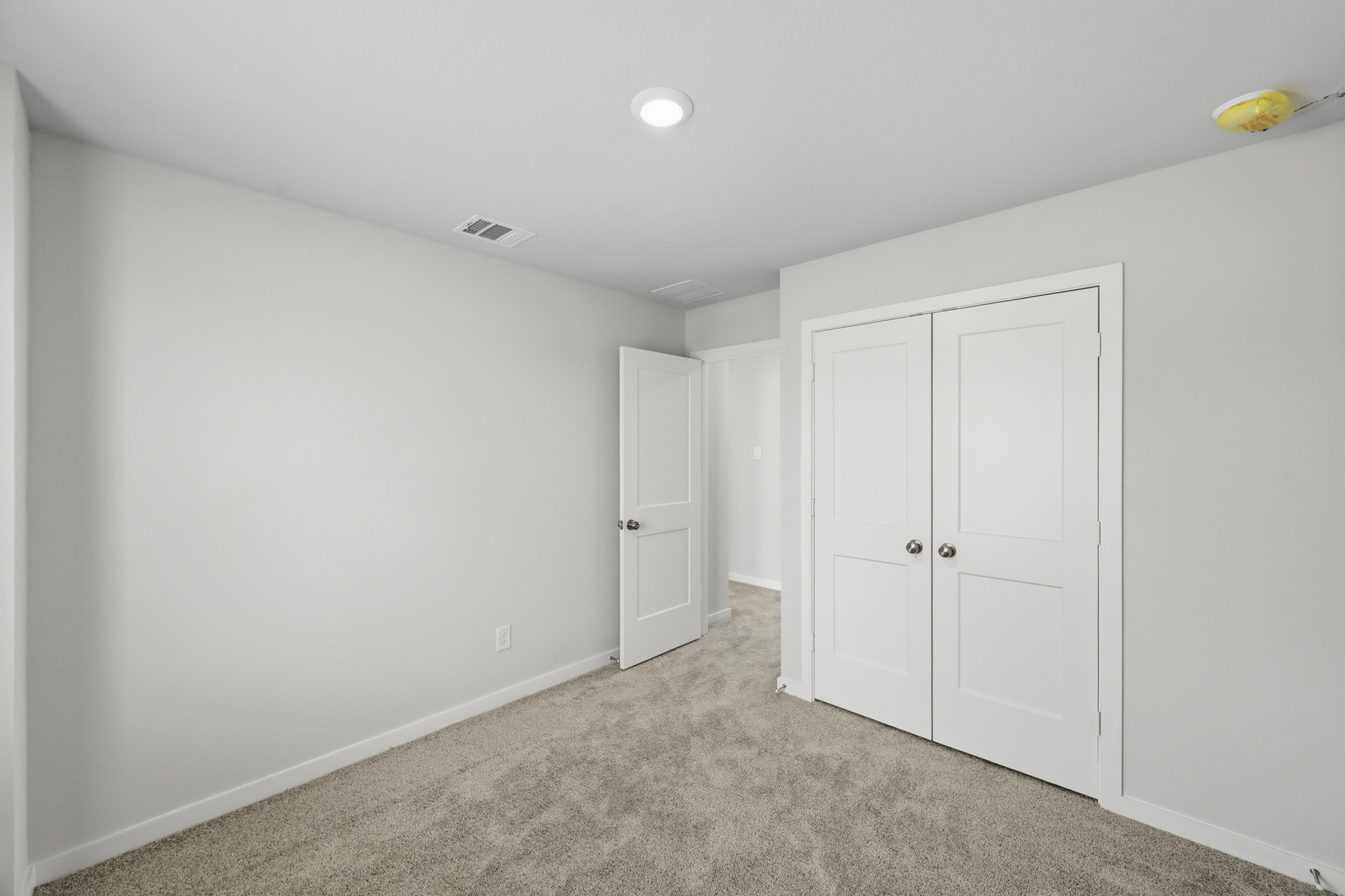A room with white doors.