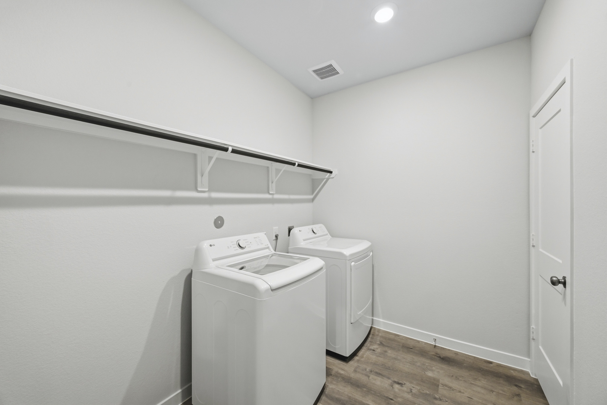 A laundry room with a washer and dryer.