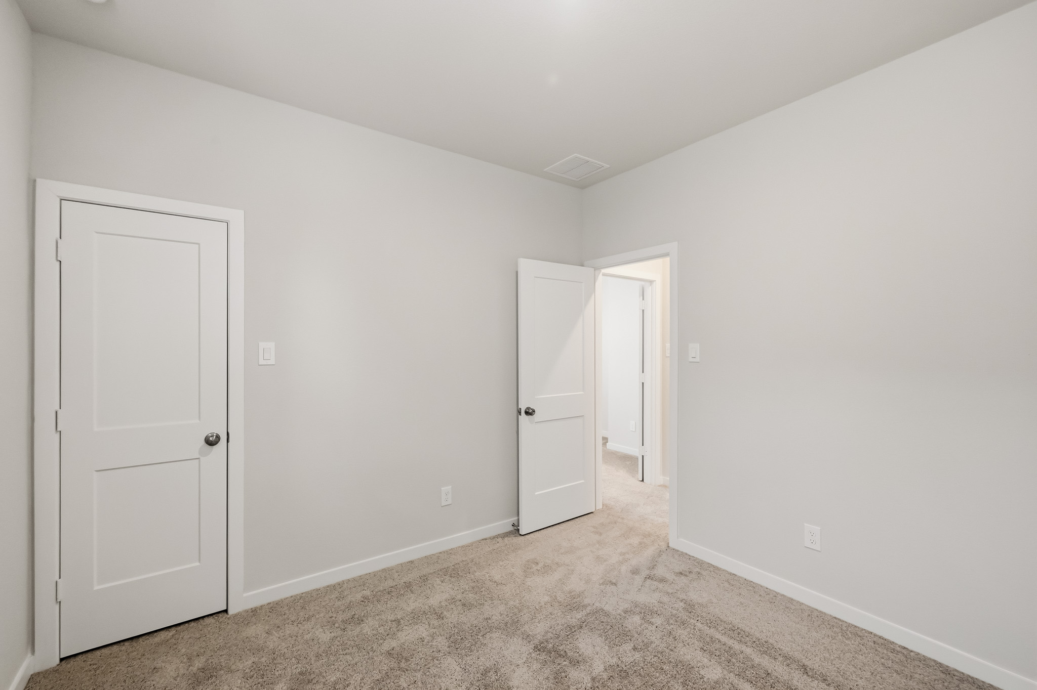 A room with white doors.