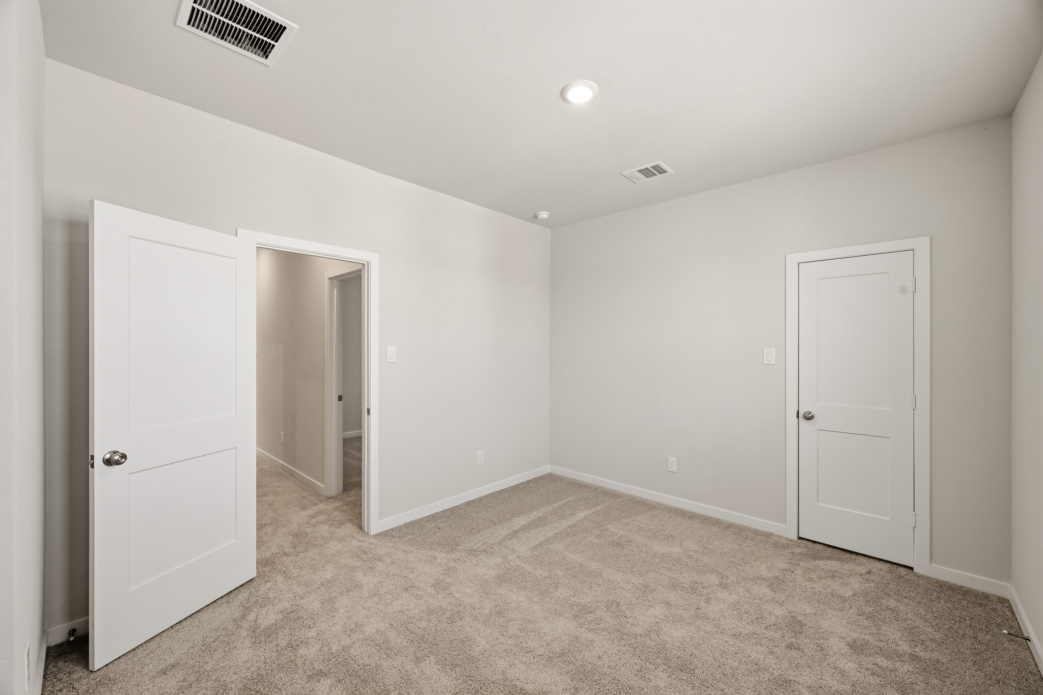 A room with white doors.