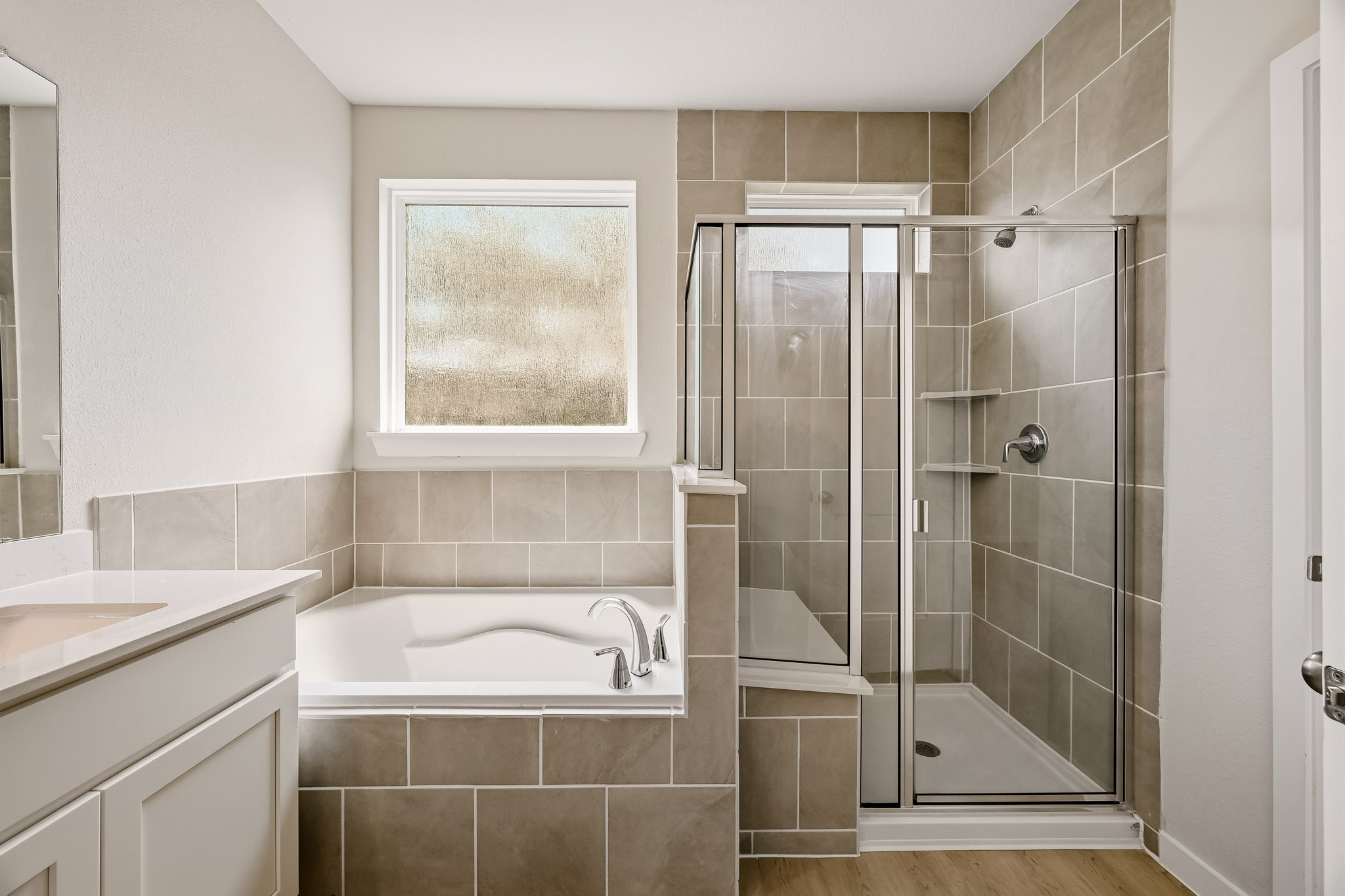 A bathroom with a glass shower.