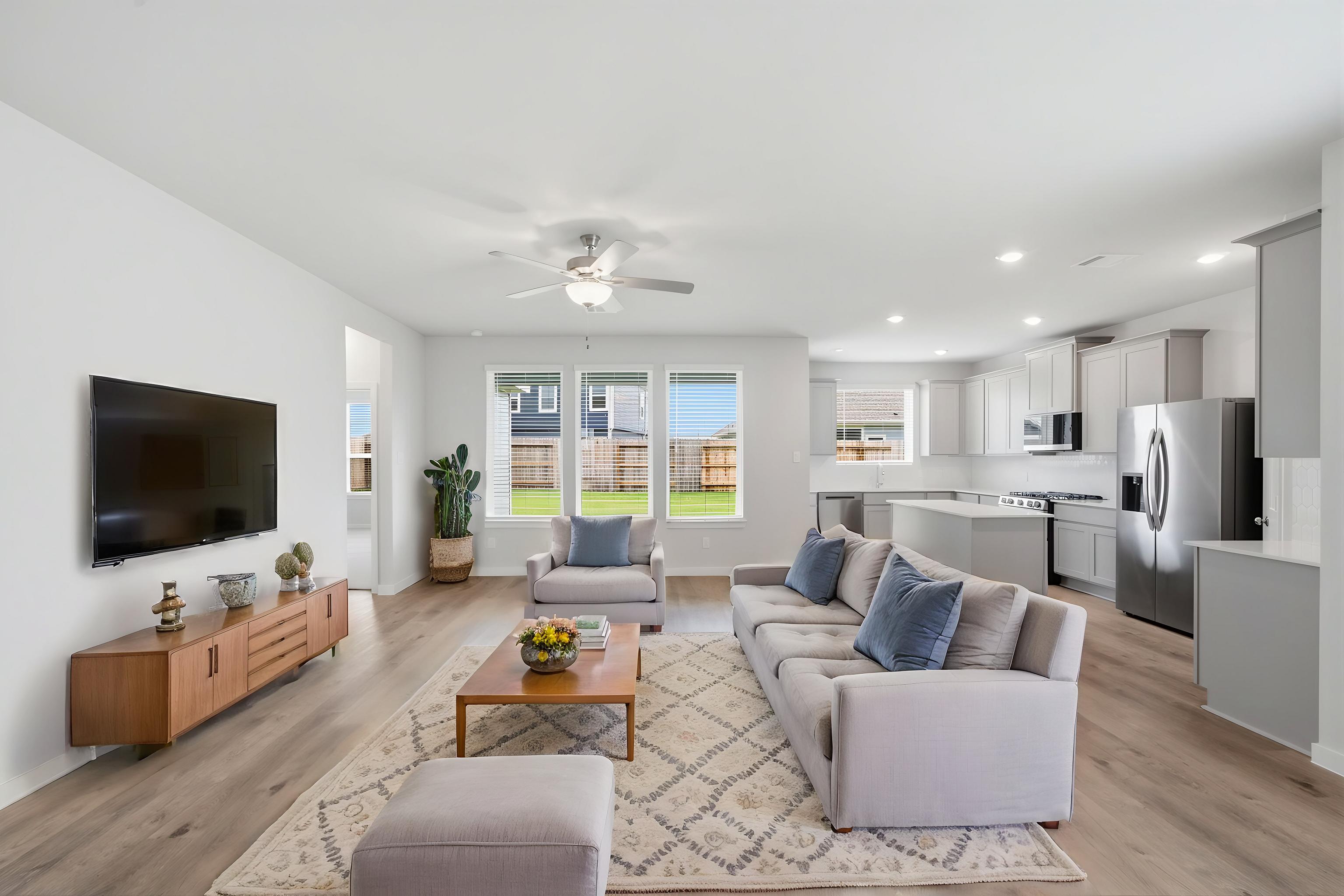 A living room with a tv and couches.