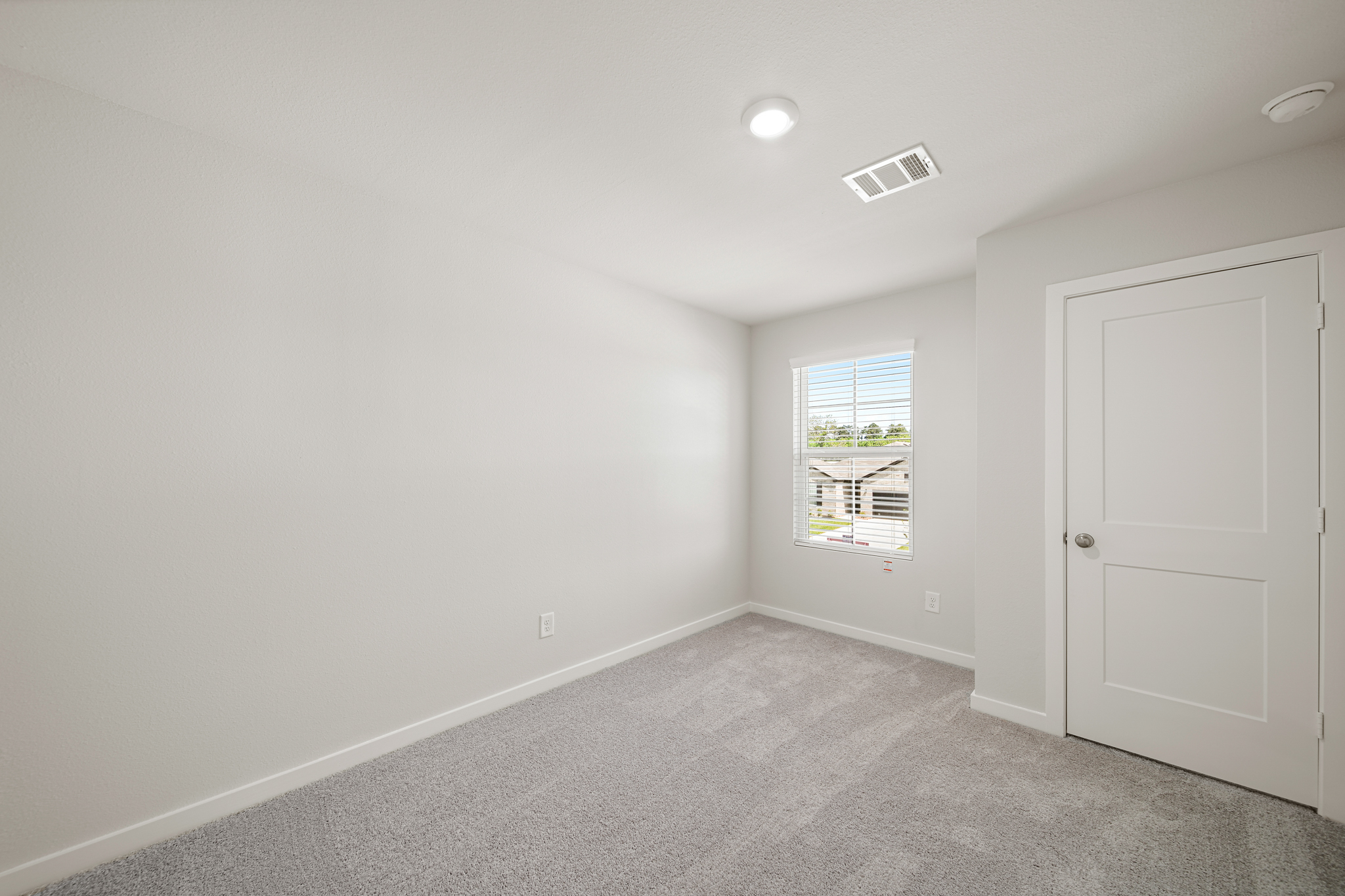 A room with a door and a window.