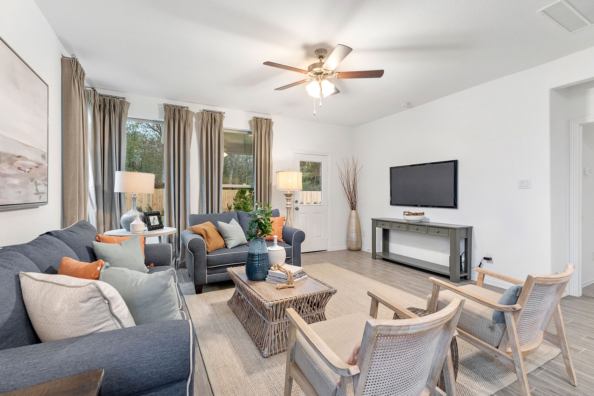 A living room with a tv and couches.