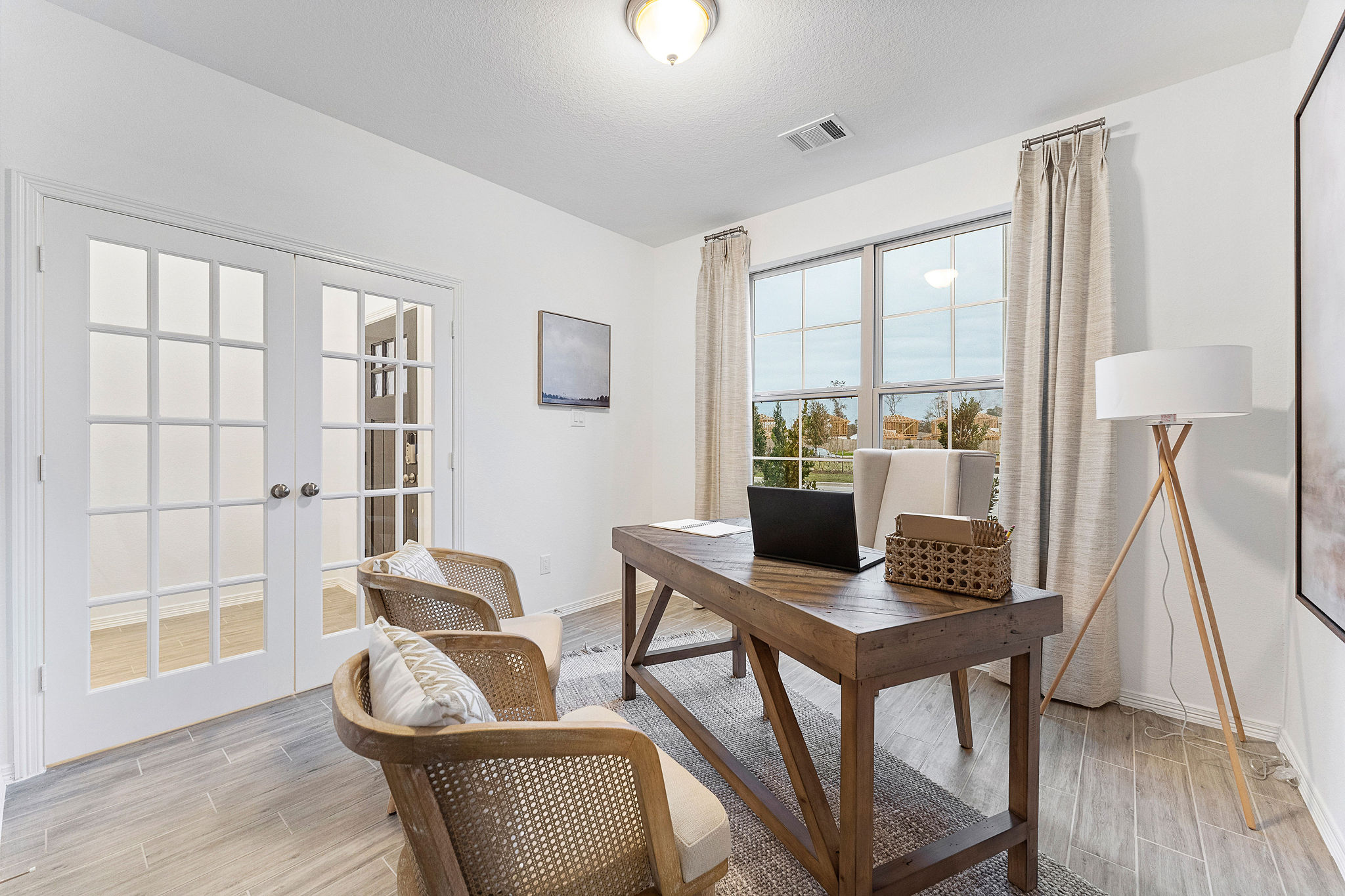 A room with a table and chairs.