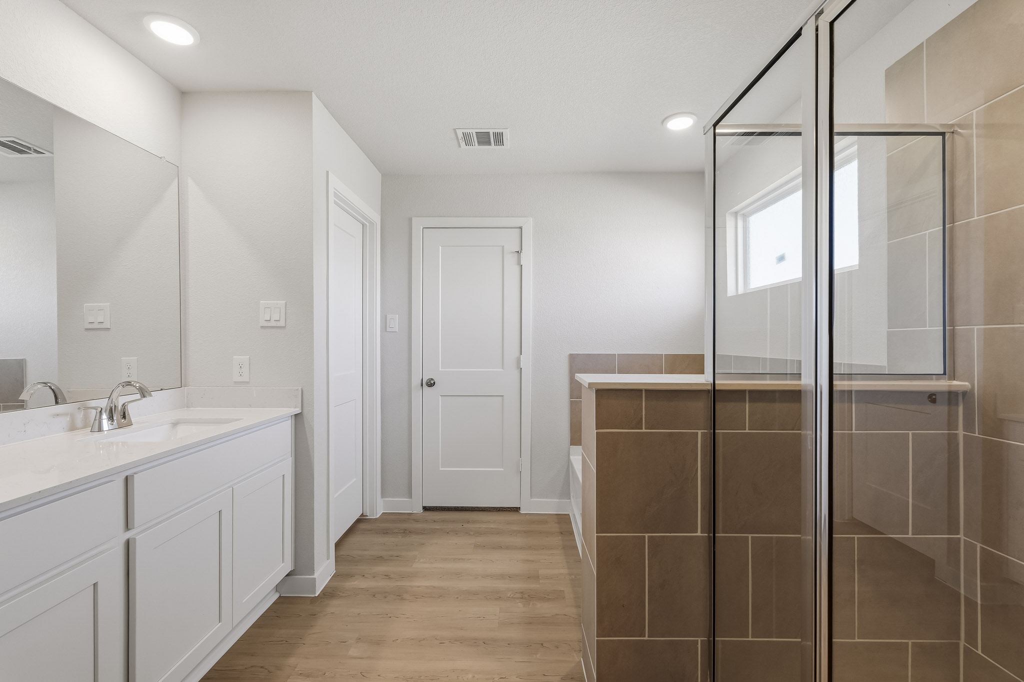 A bathroom with a glass shower.