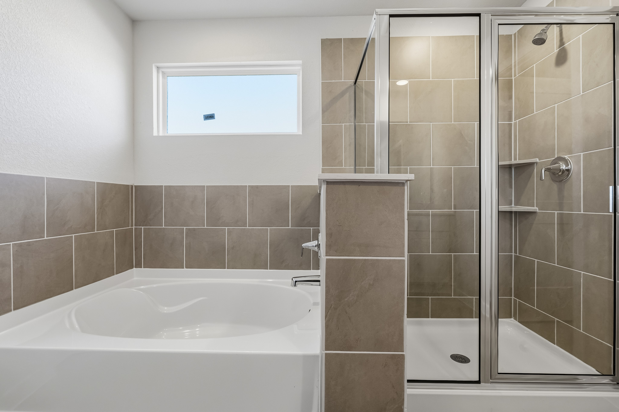 A bathroom with a glass shower.