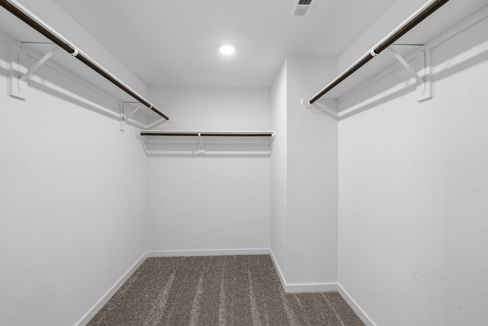 A hallway with white walls.