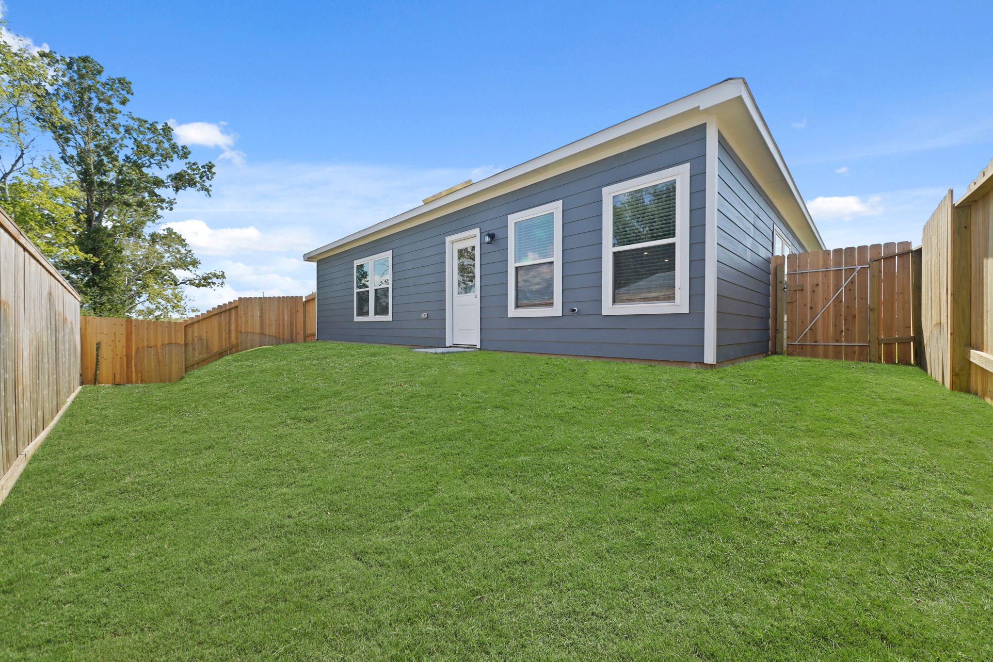 A house with a fence around it.