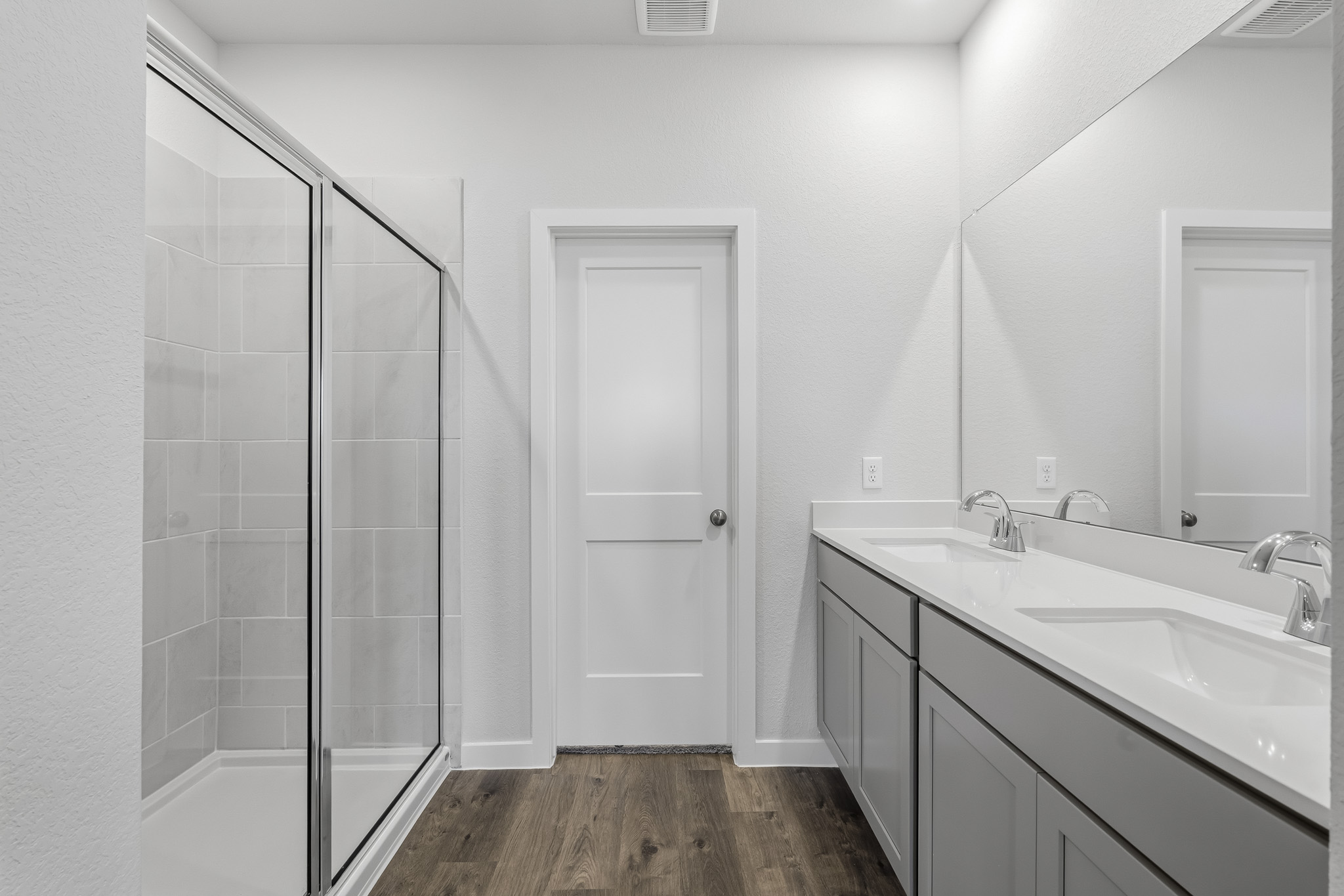 A bathroom with a glass shower.