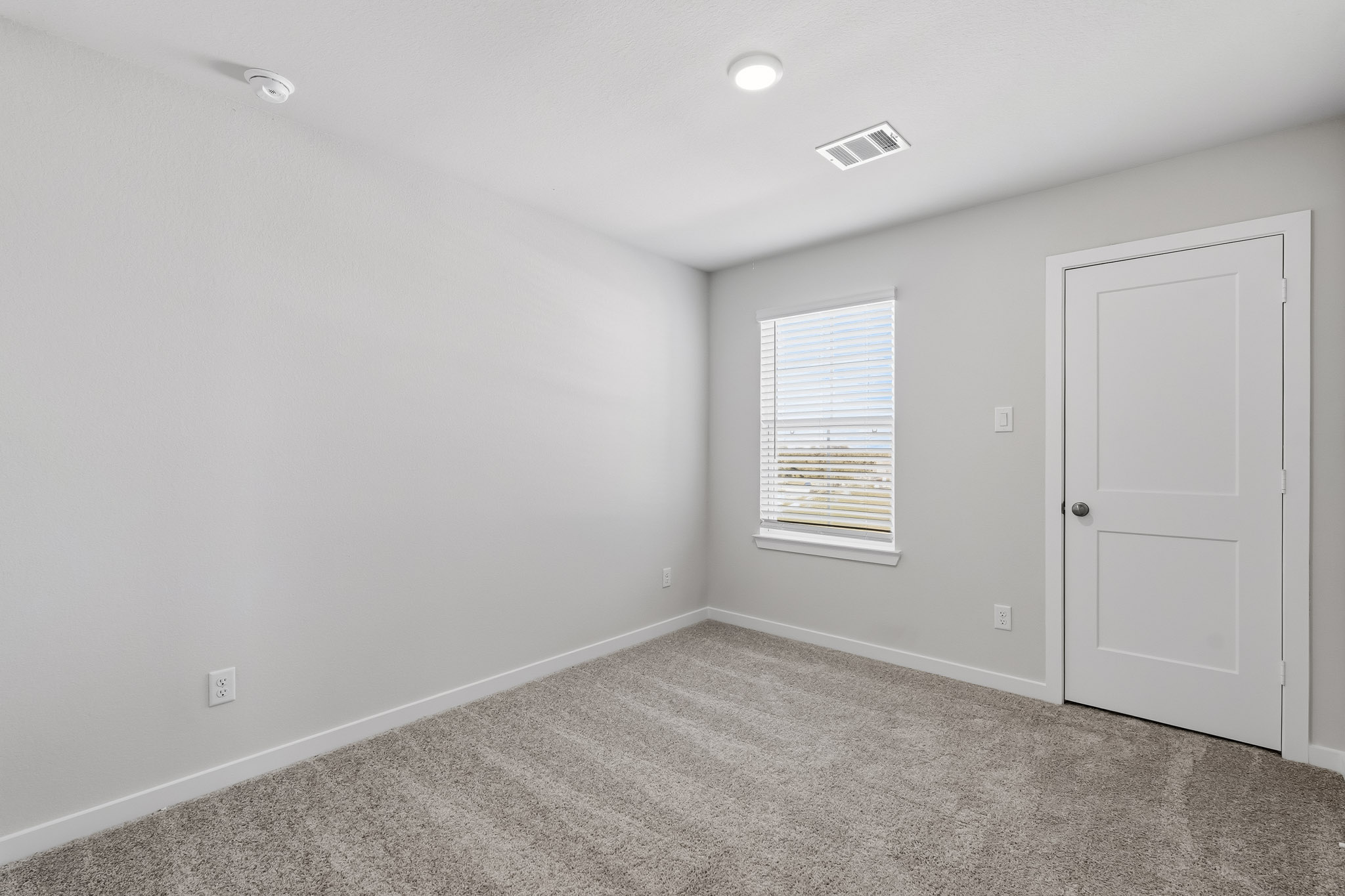 A room with a door and a window.