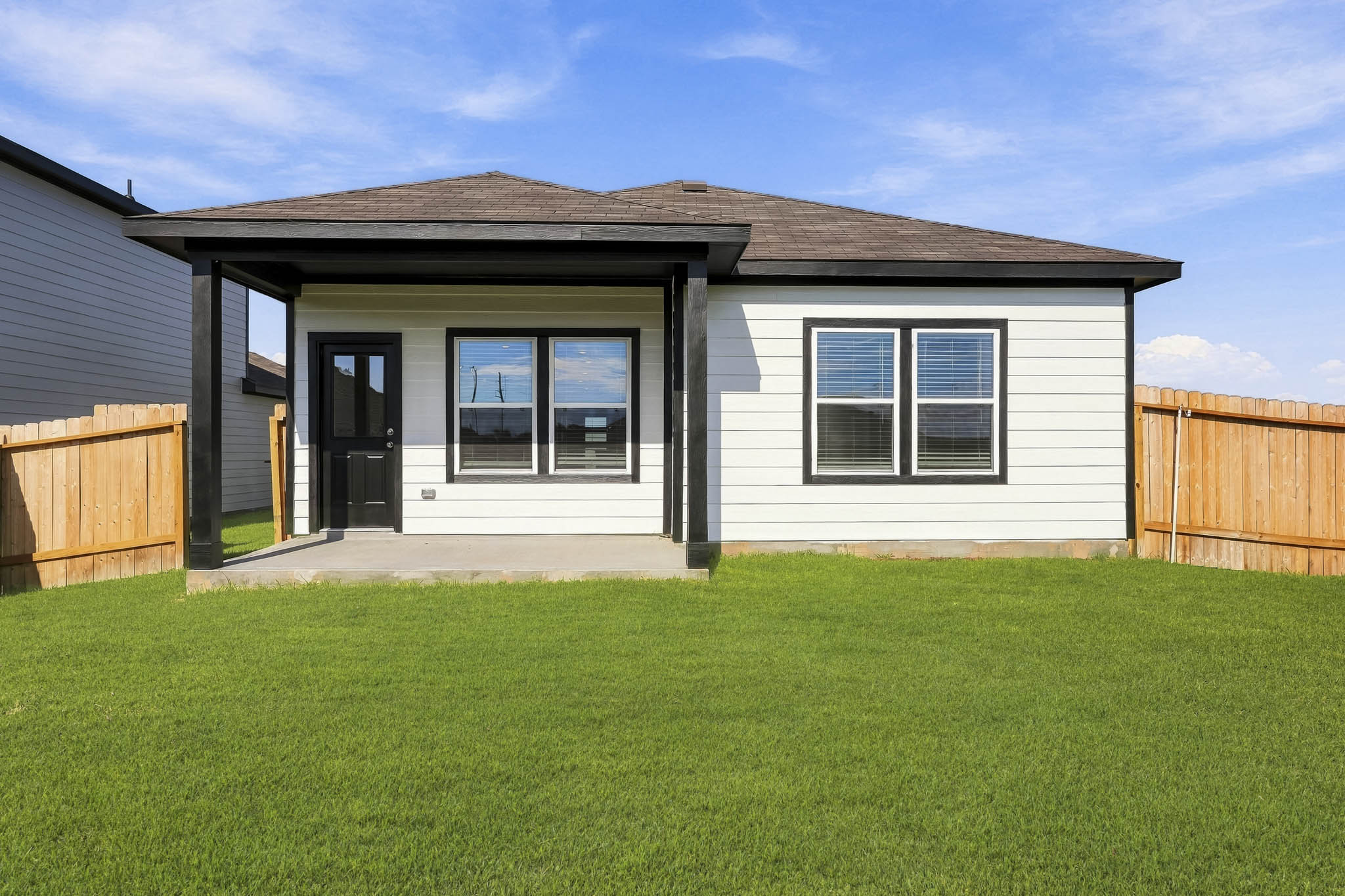 A house with a grass yard.