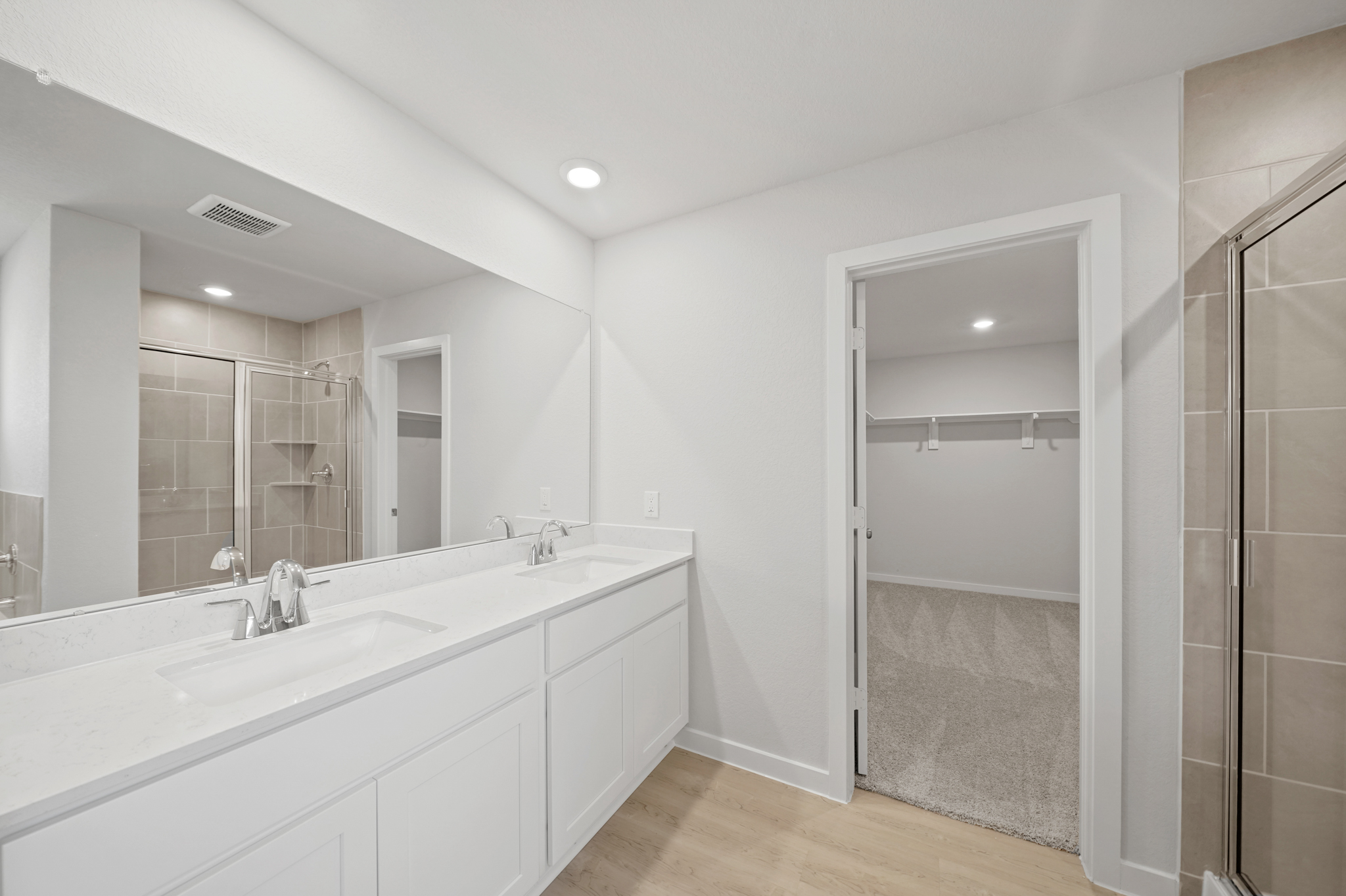 A bathroom with a glass shower.