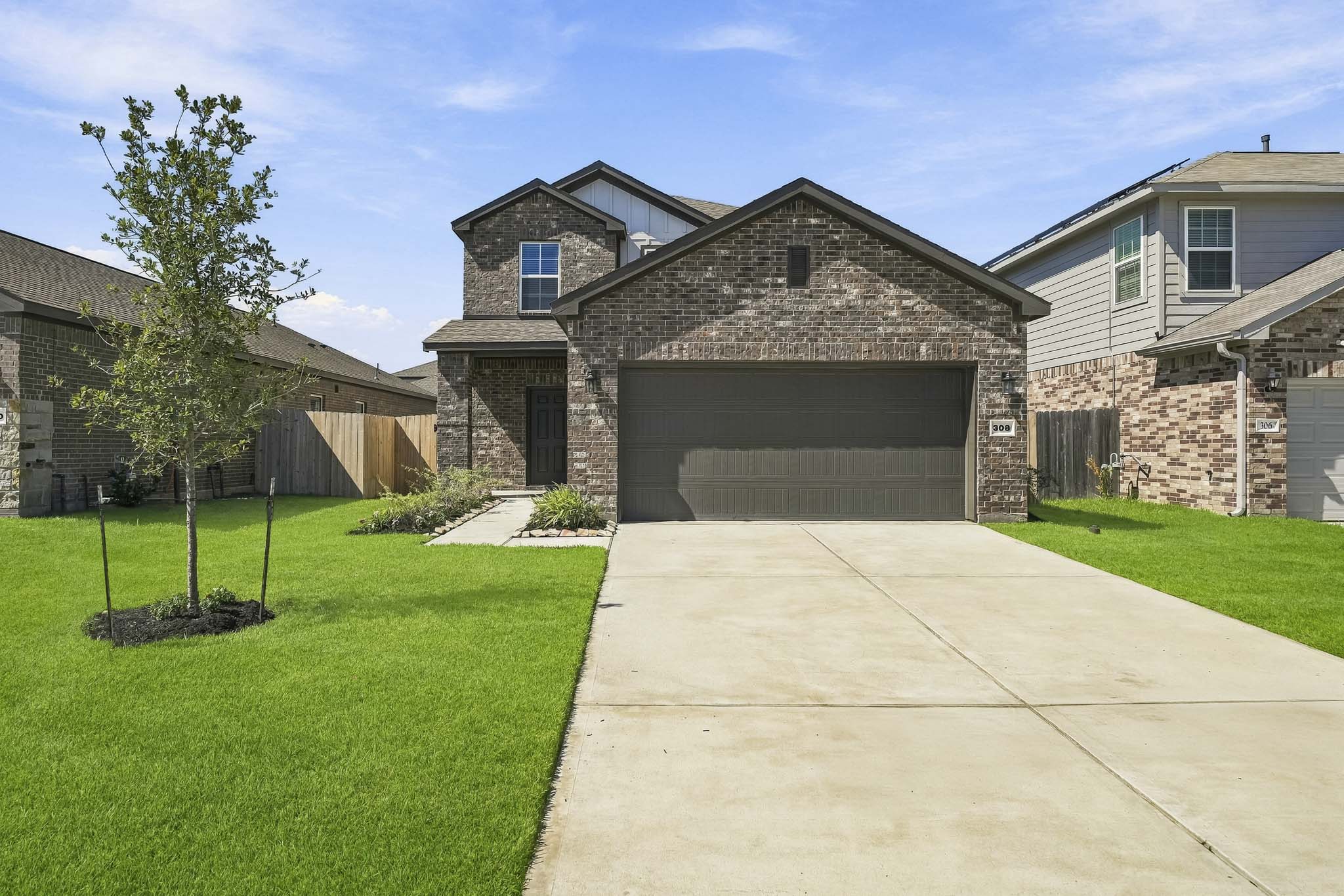A driveway leading to a house.