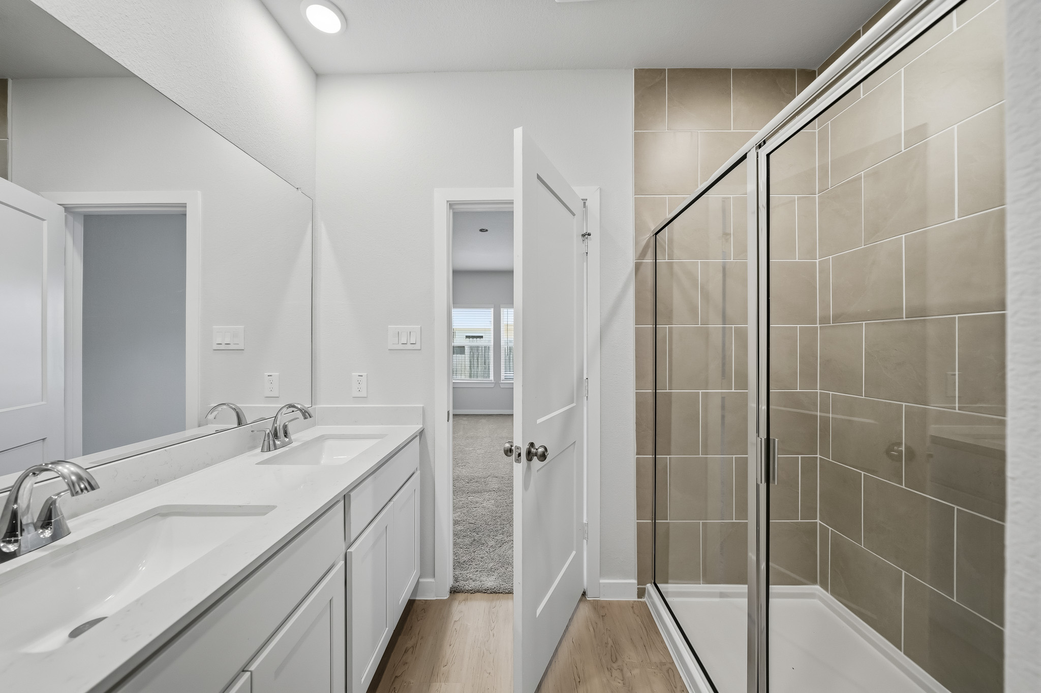 A bathroom with a glass shower.