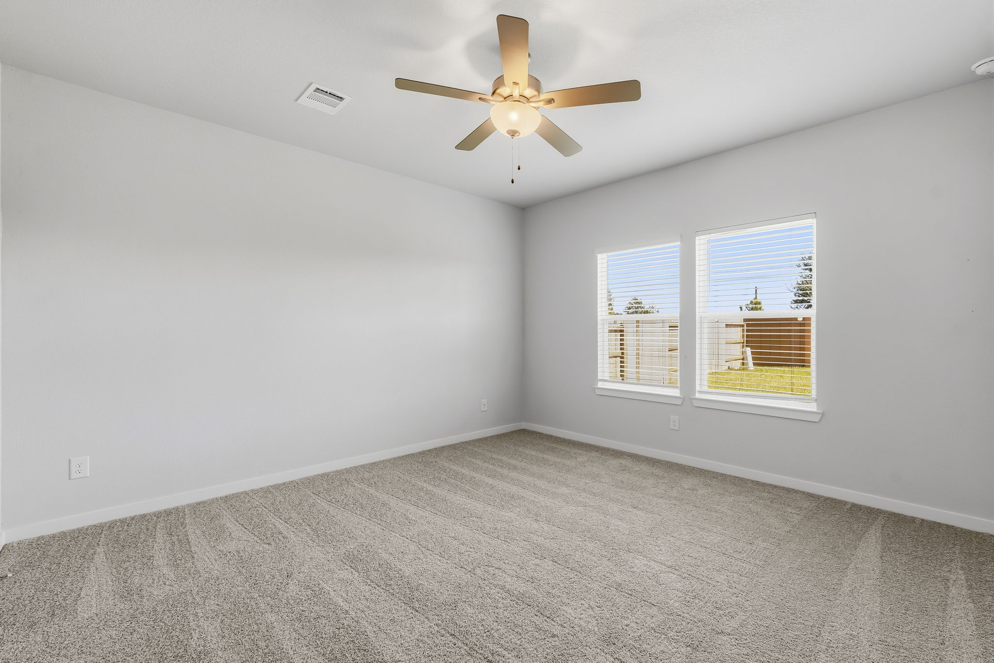 A ceiling fan in a room.