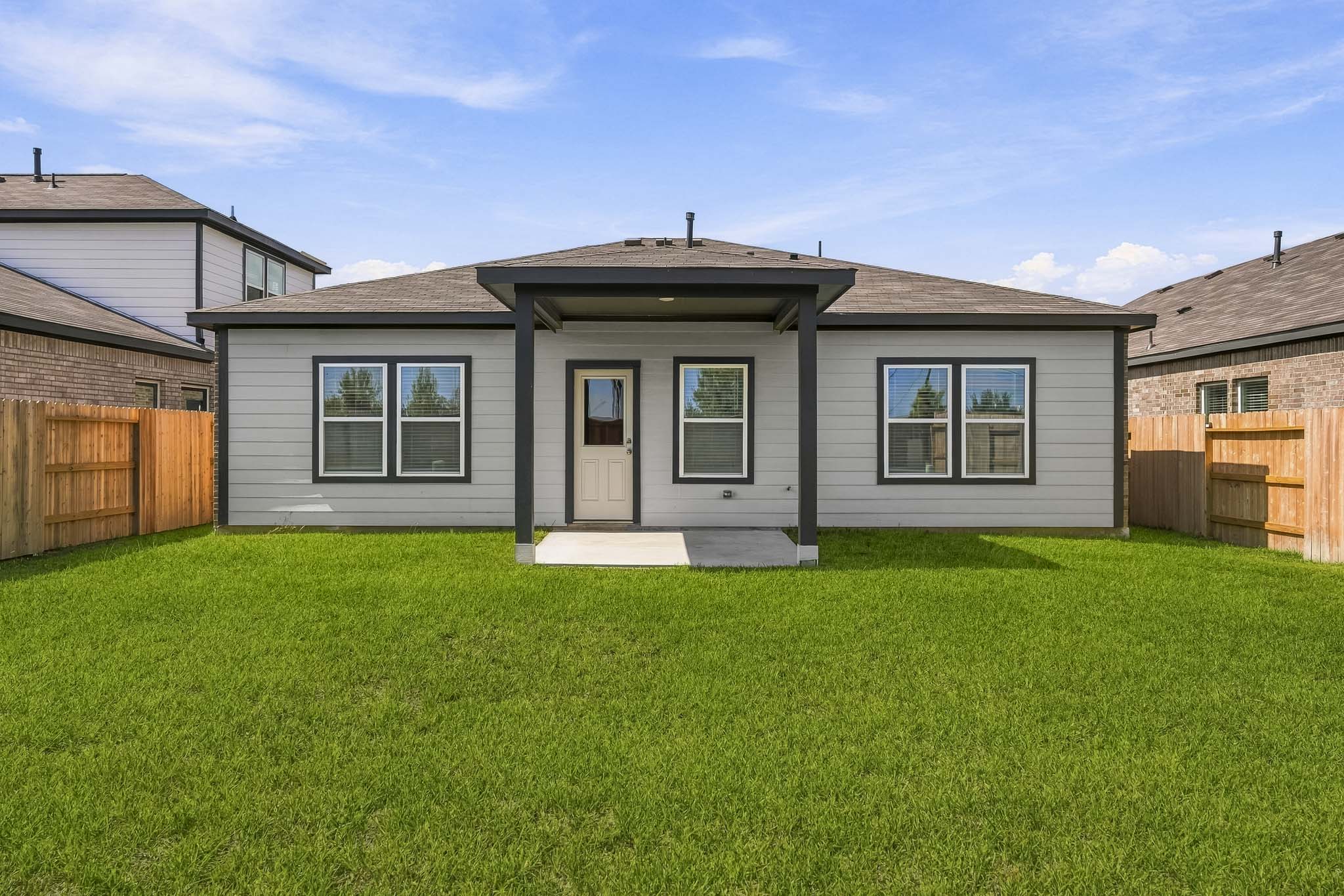 A house with a grass yard.