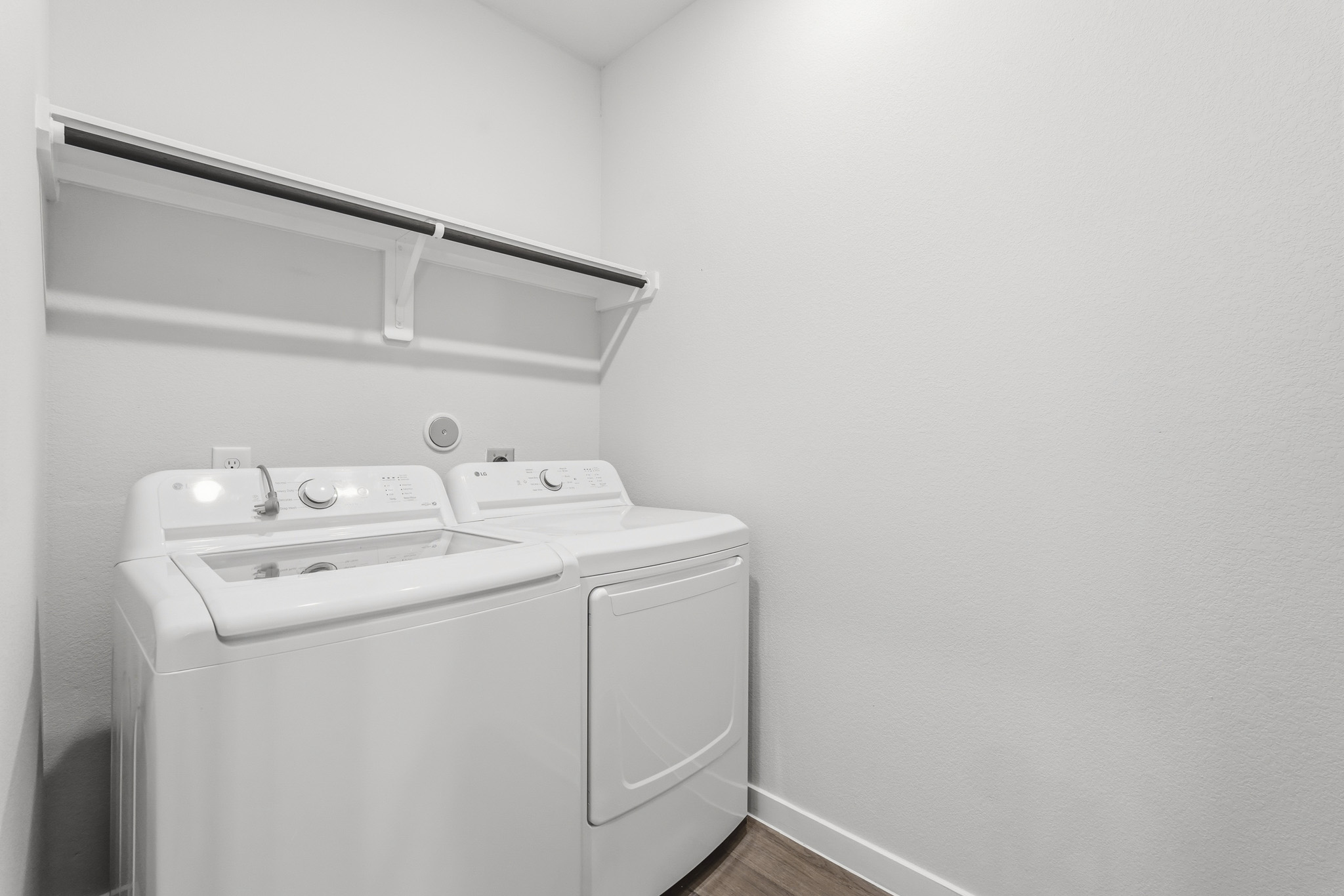 A washer and dryer in a room.