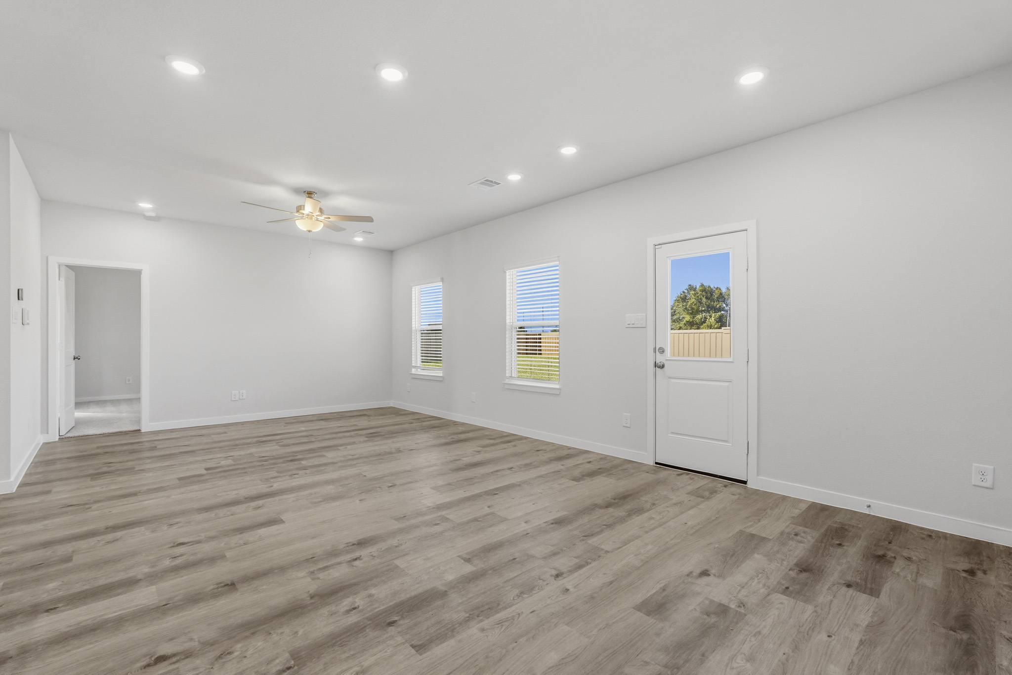 A room with a wood floor and a wood floor.