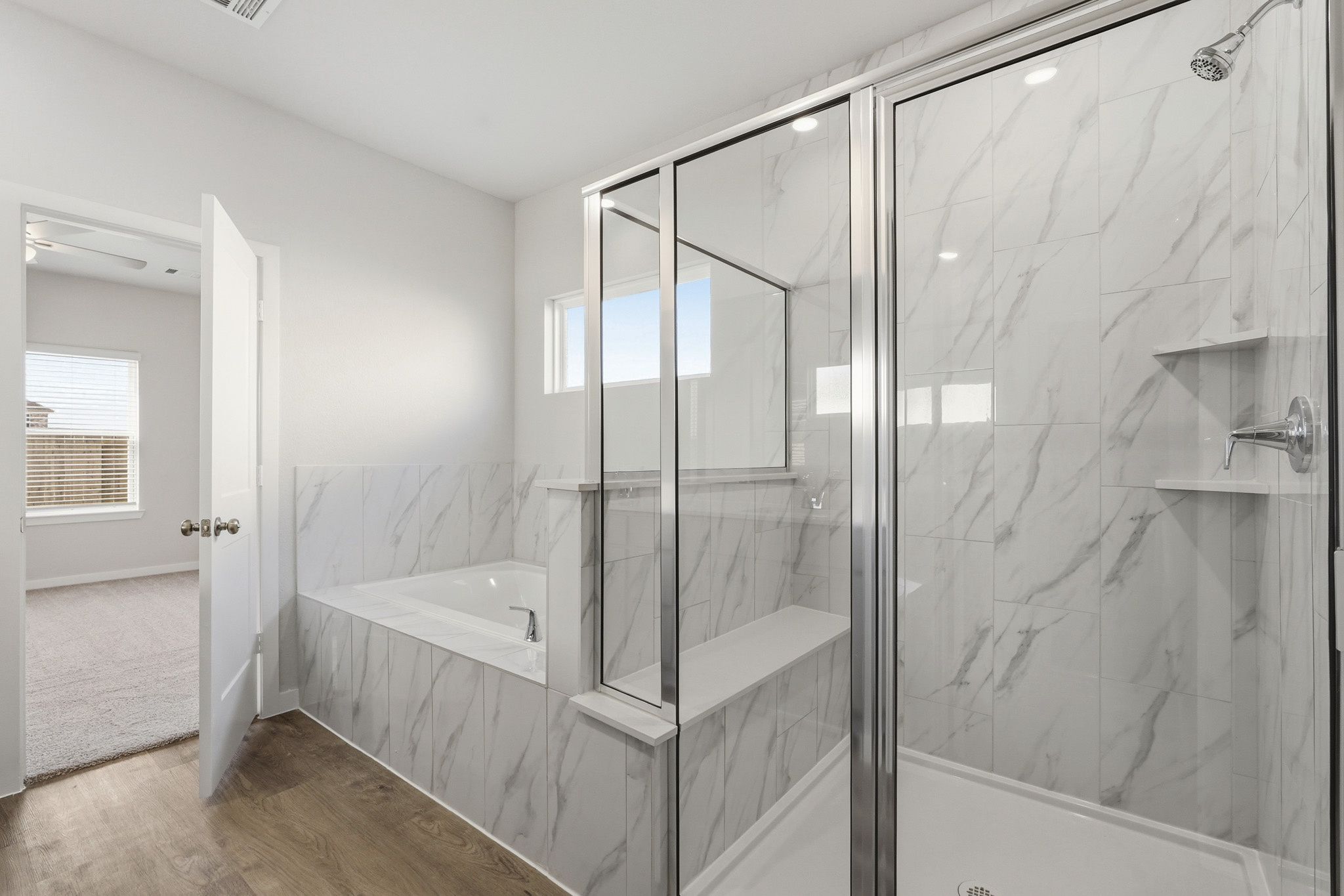 A bathroom with a glass shower.