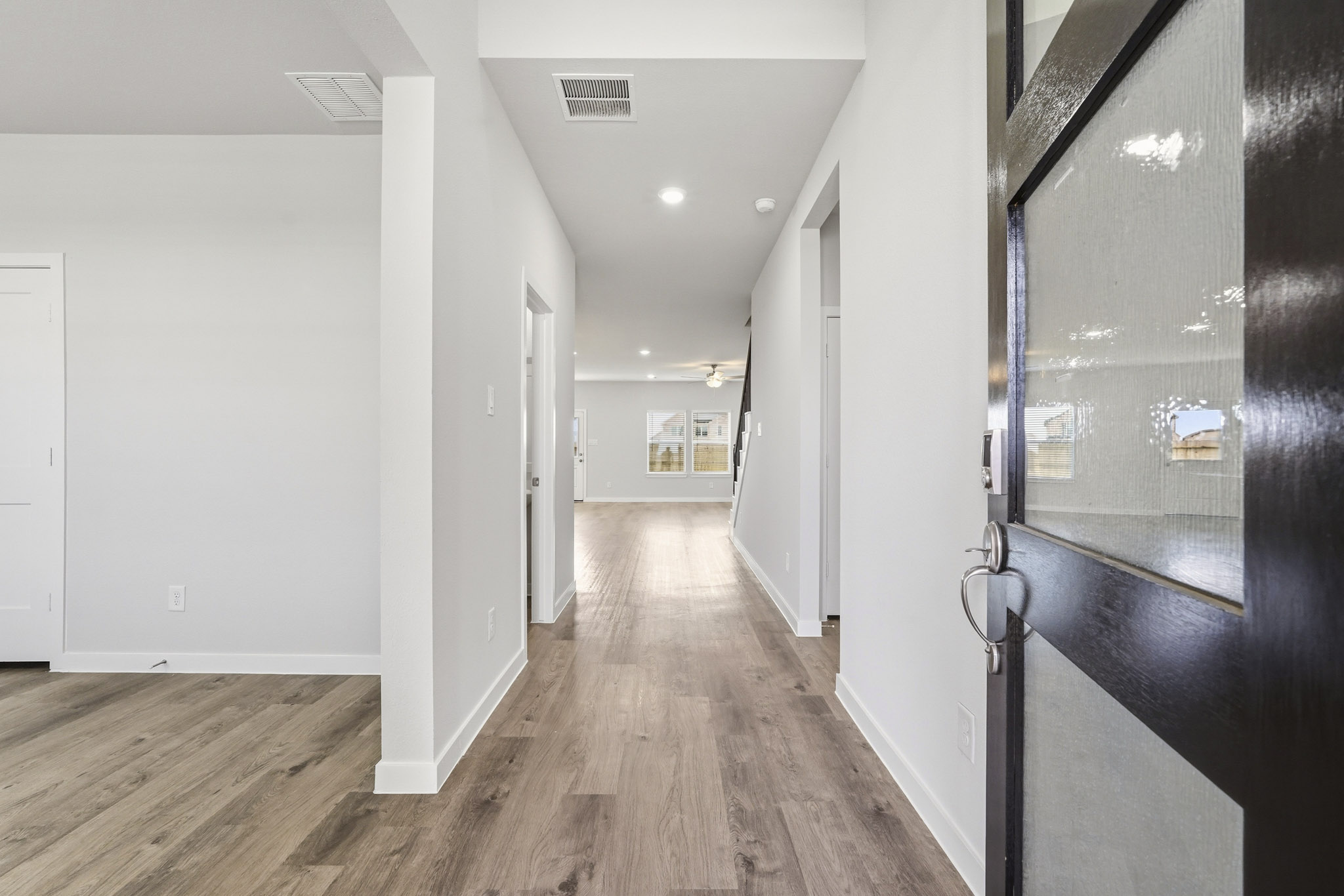 A hallway with white walls.