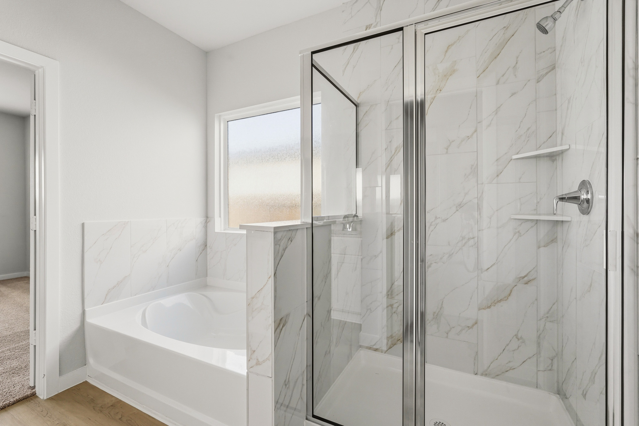 A bathroom with a glass shower.