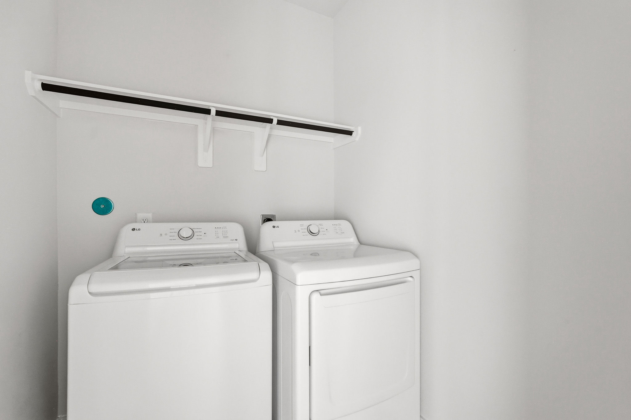 A washing machine in a room.