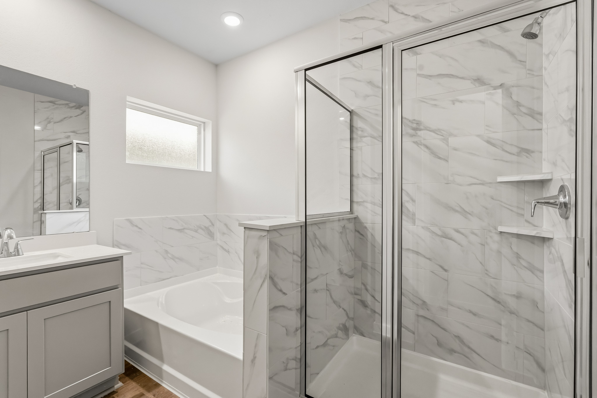 A bathroom with a glass shower.