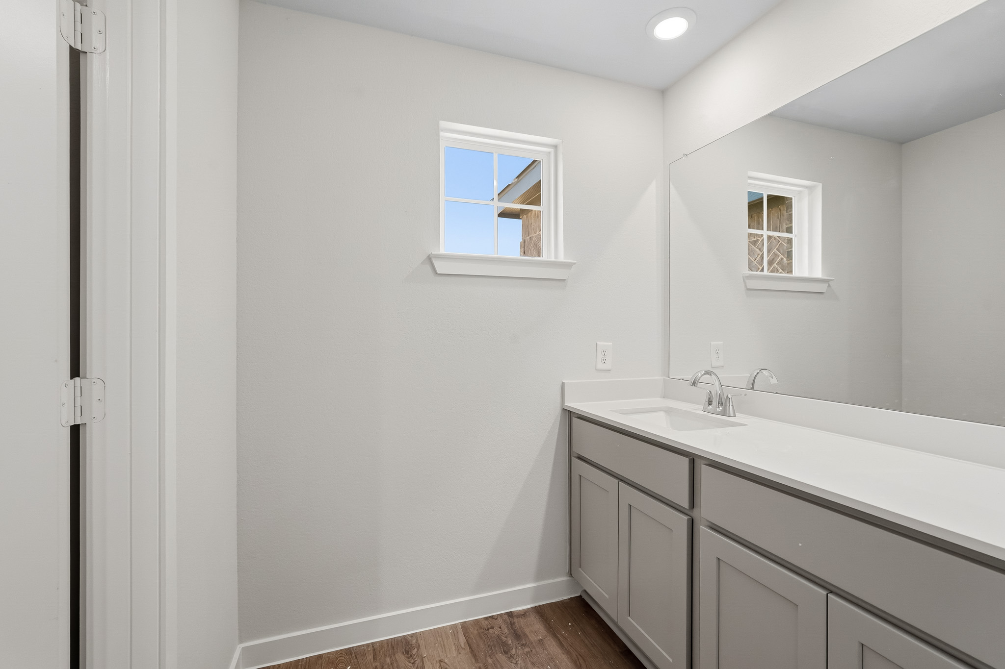 A bathroom with white walls.