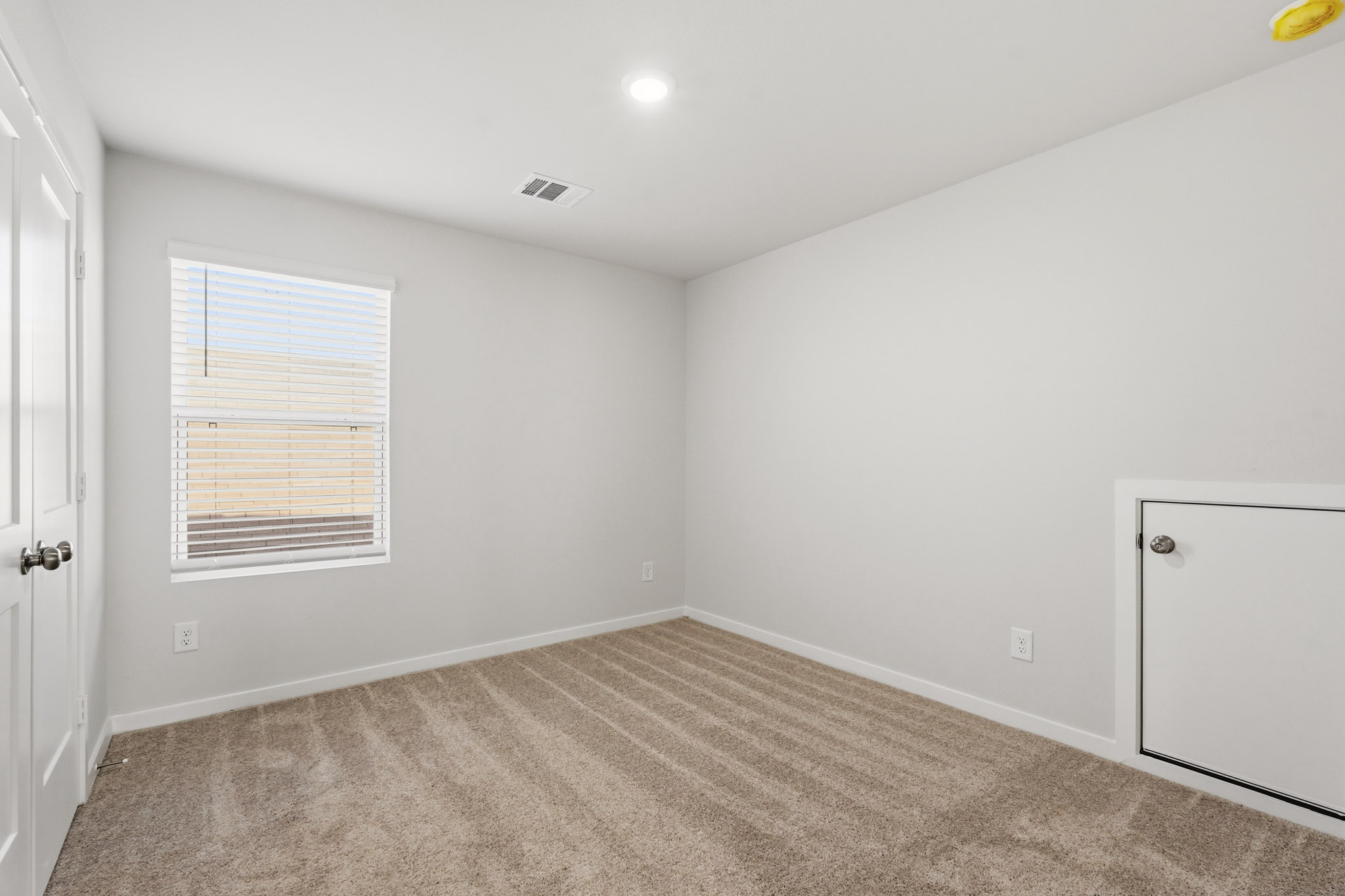 A room with a door and a window.