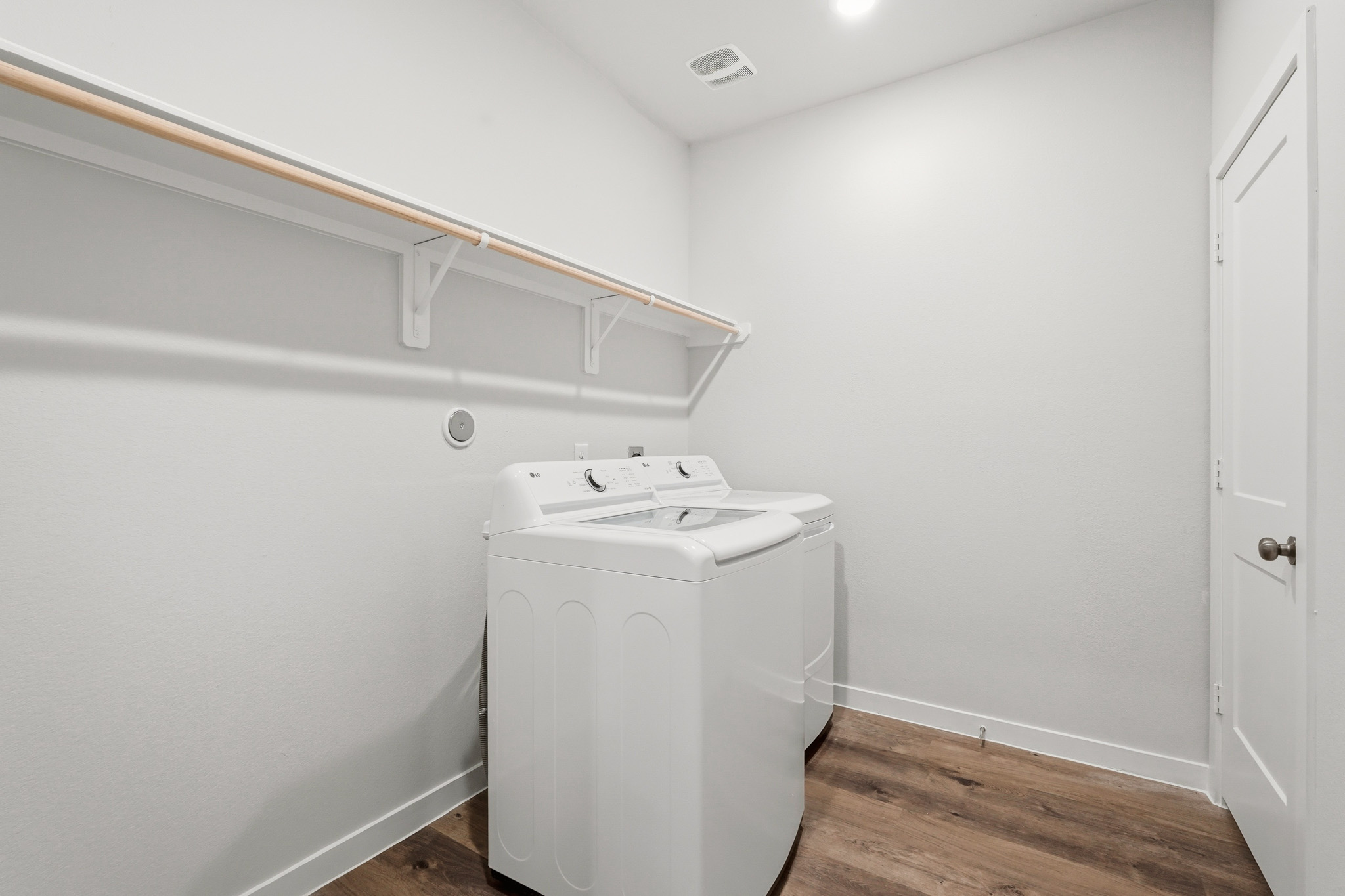 A white washing machine in a room.