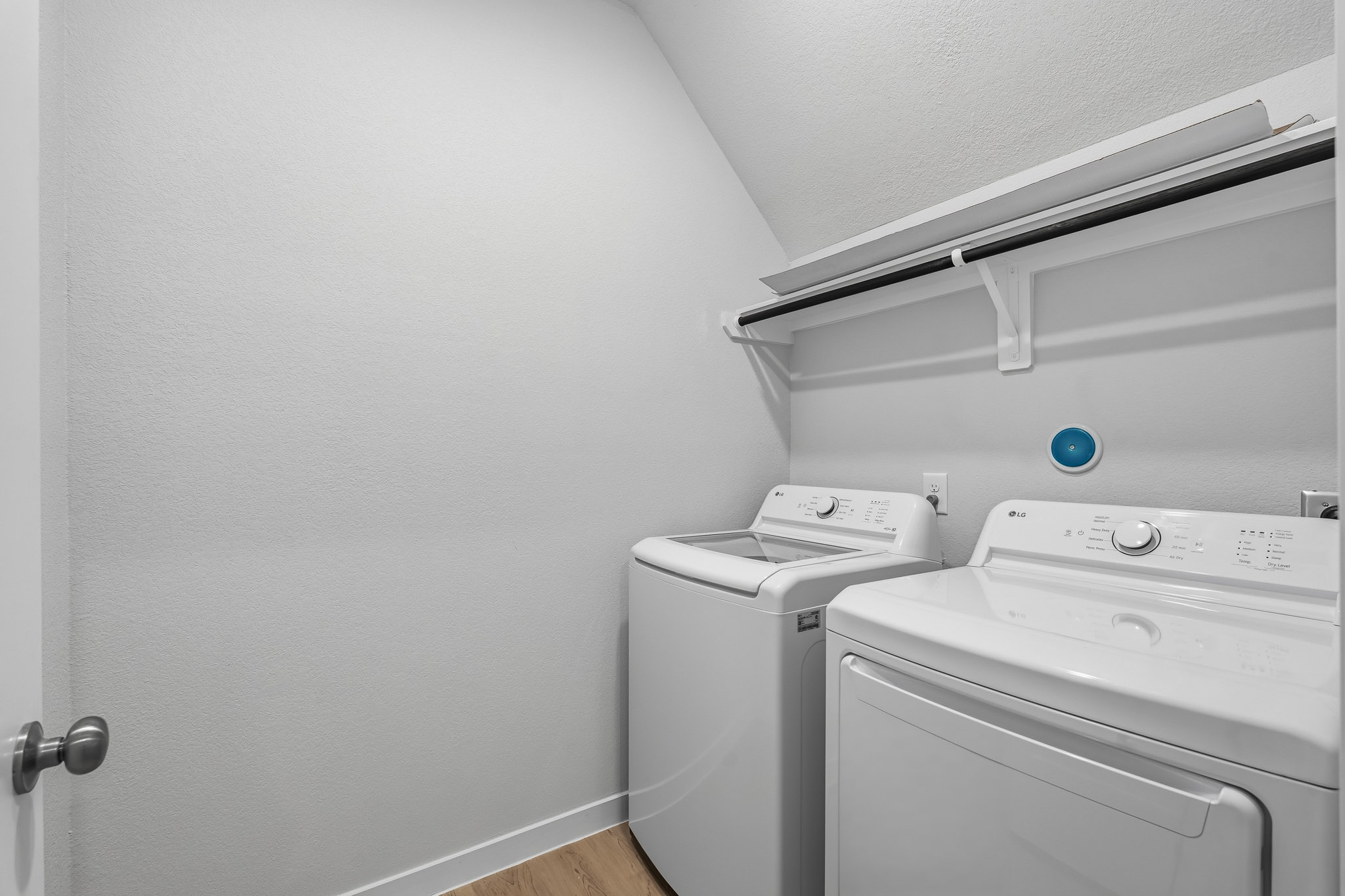 A washing machine in a room.