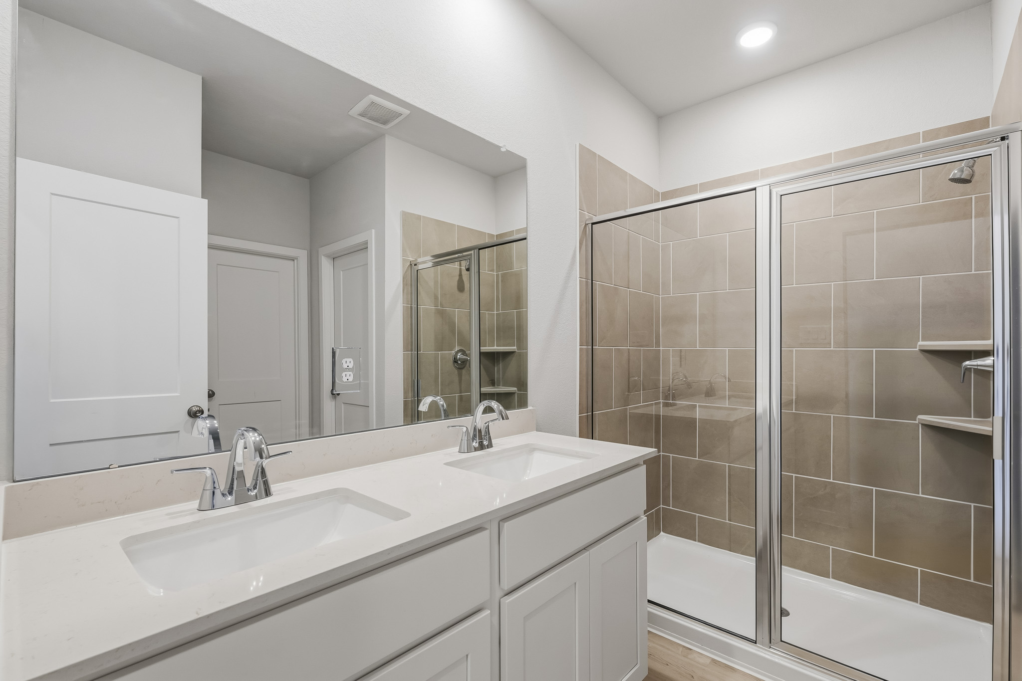 A bathroom with a glass shower.