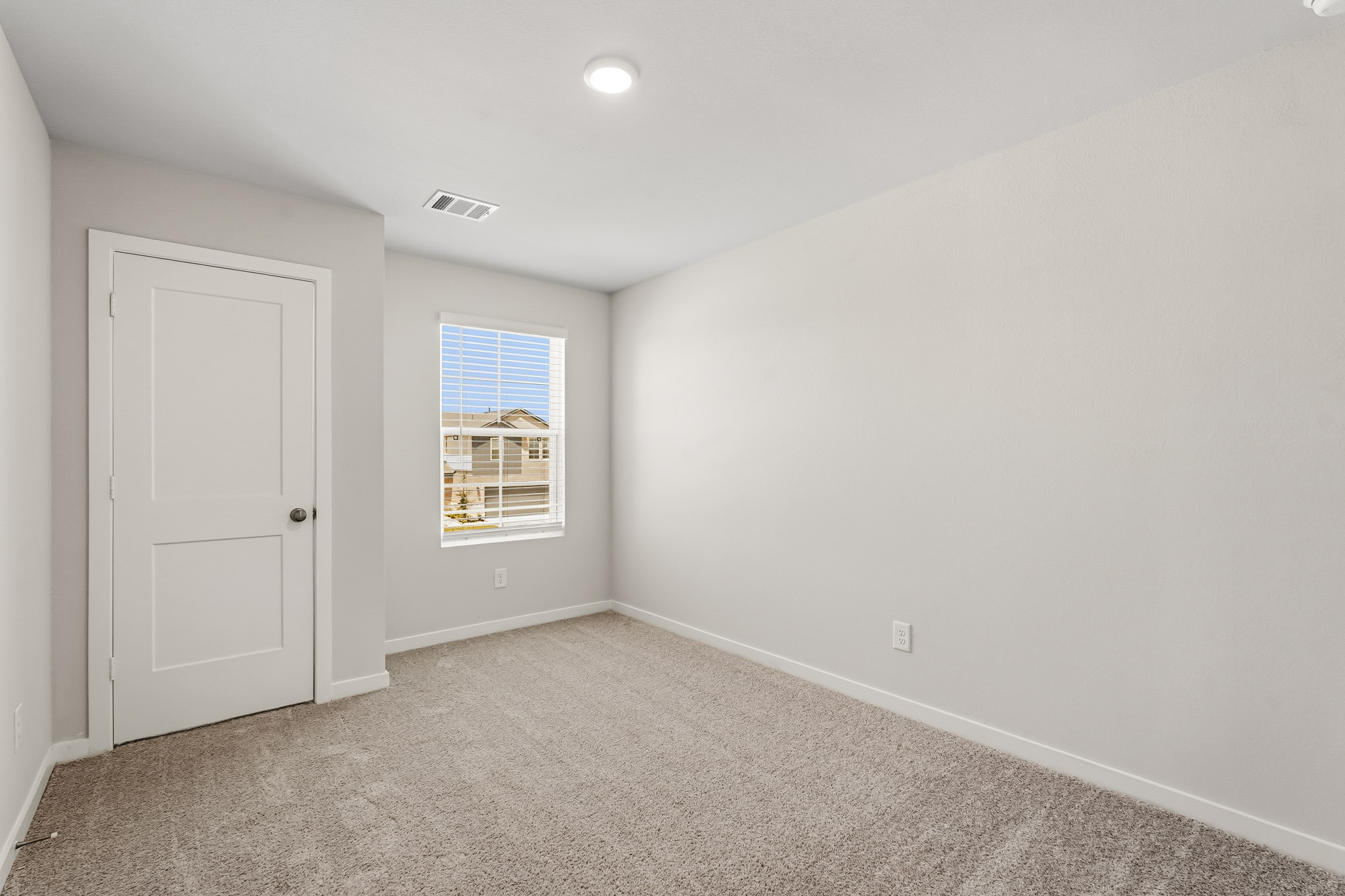 A room with a door and a window.
