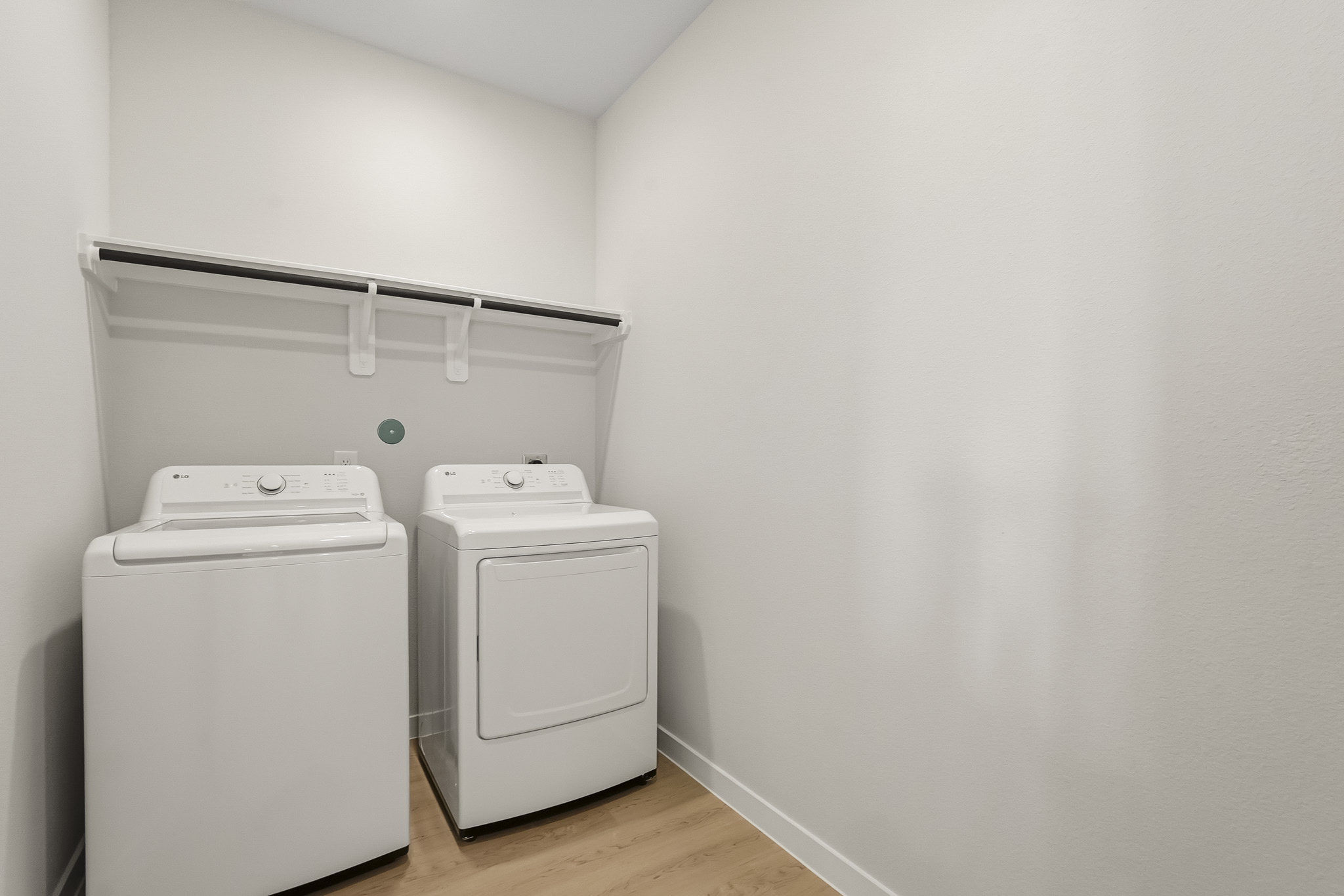 A white wall with a white machine and a white wall.