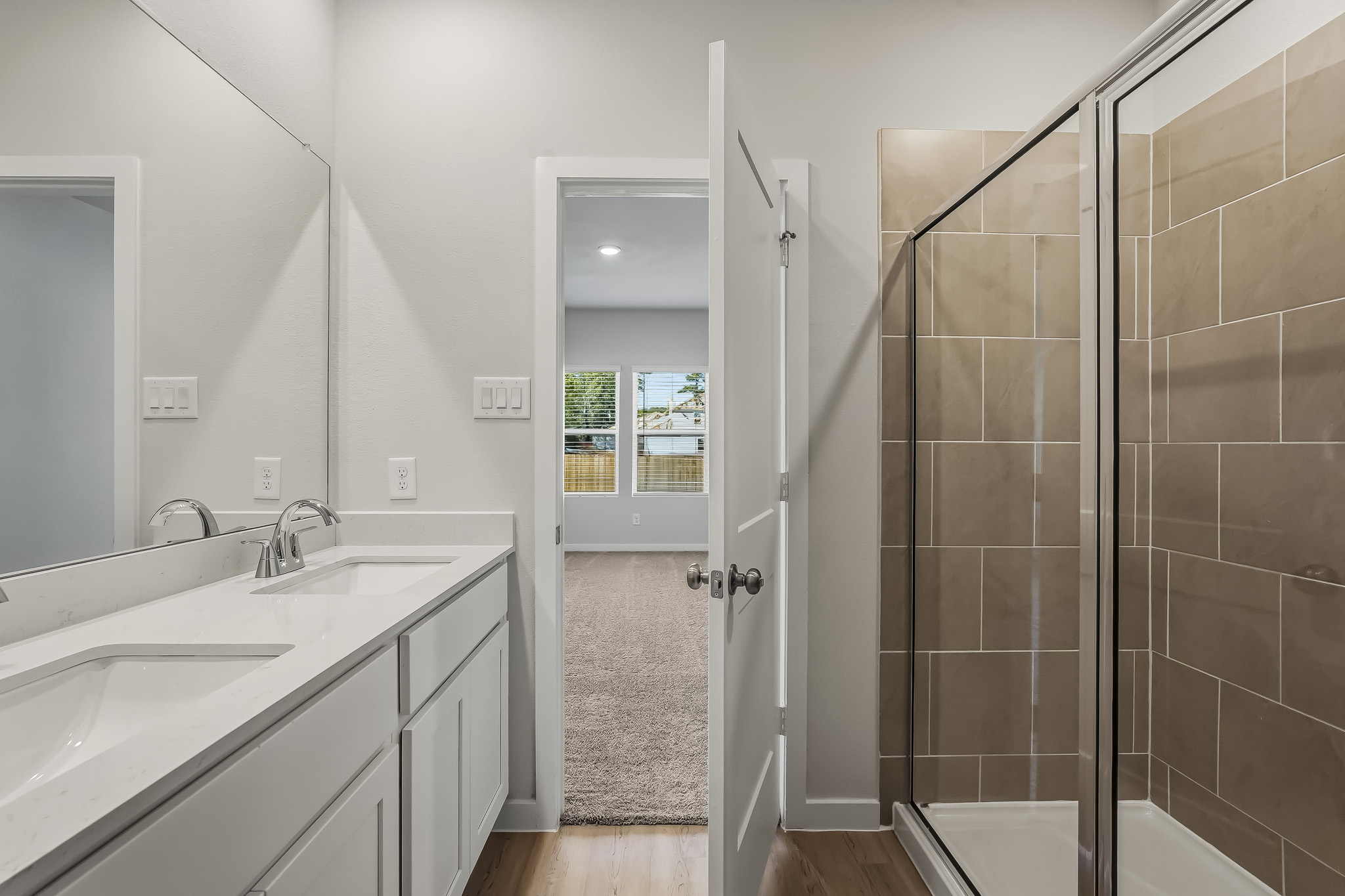 A bathroom with a glass shower.