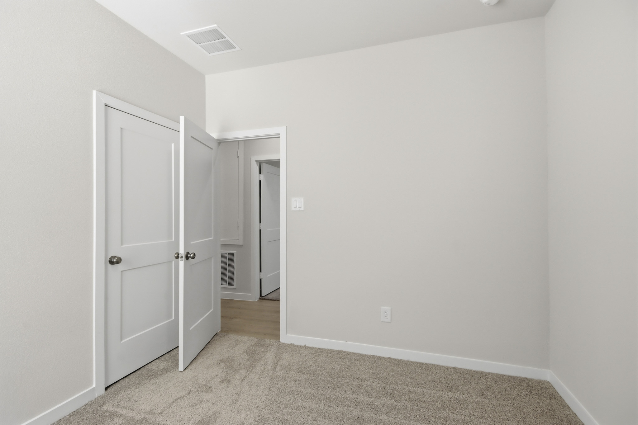 A room with white doors.