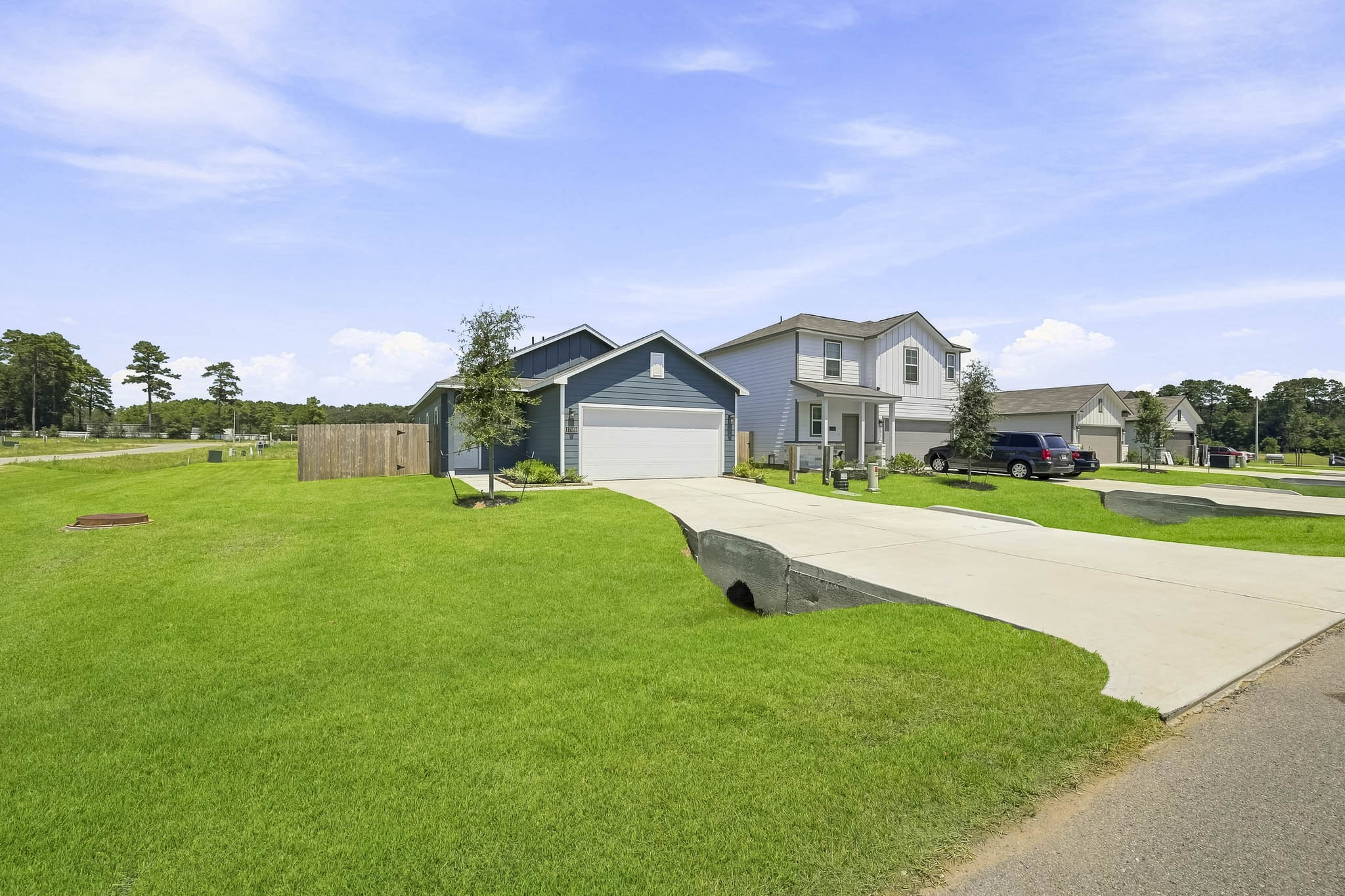 A neighborhood with a large lawn.