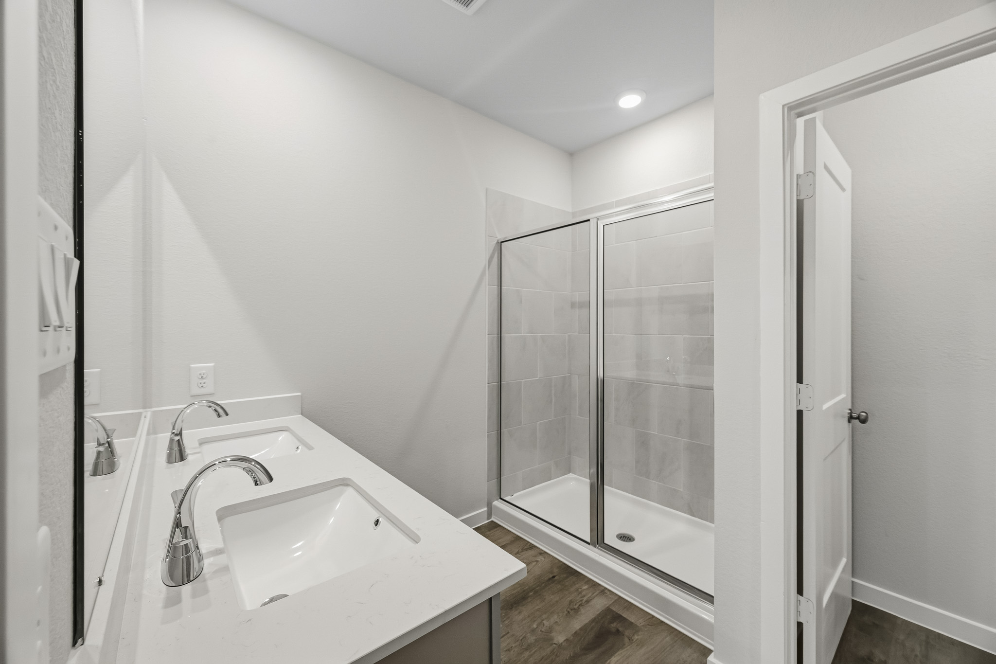 A bathroom with a glass shower.