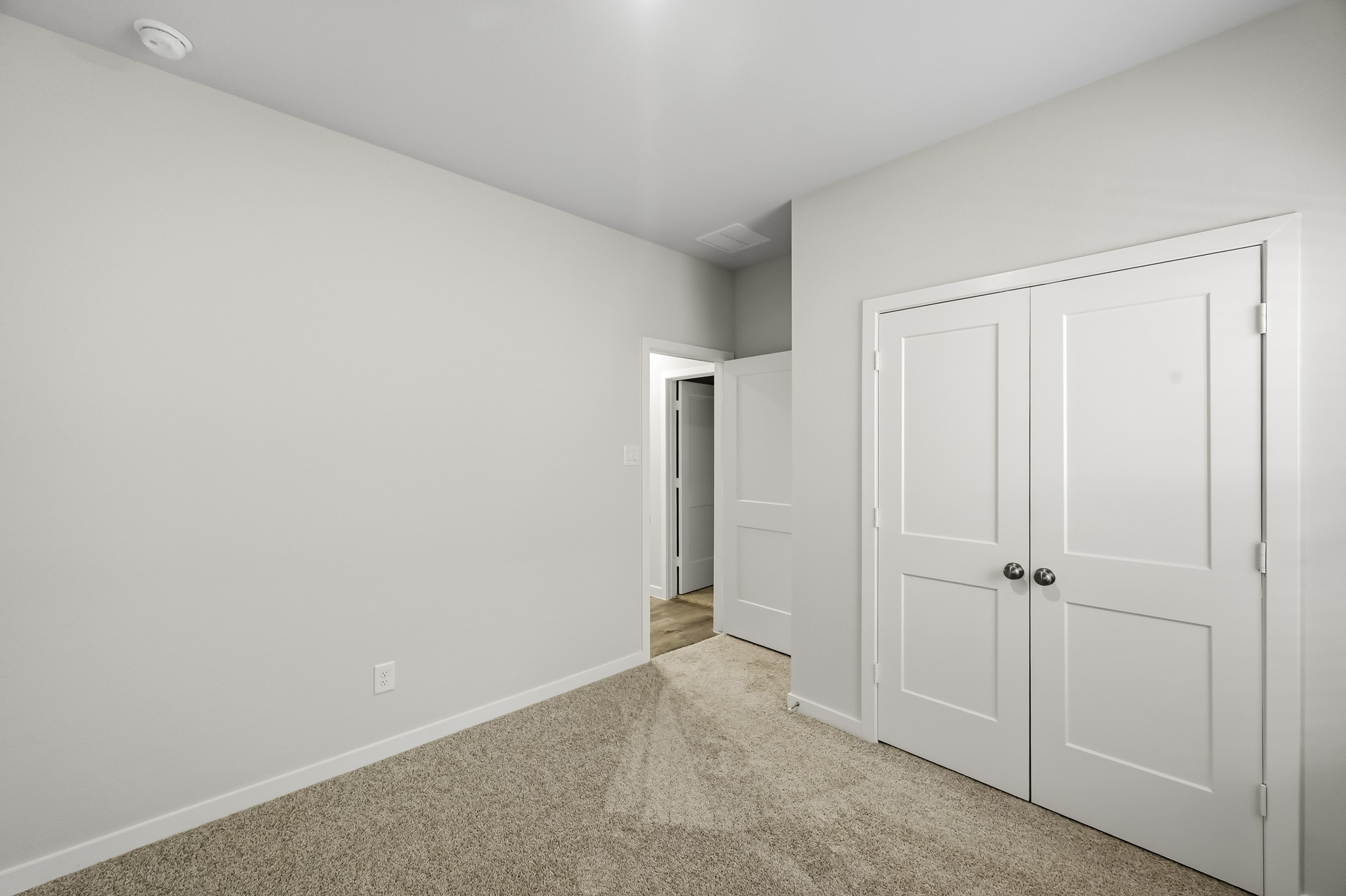 A room with white doors.