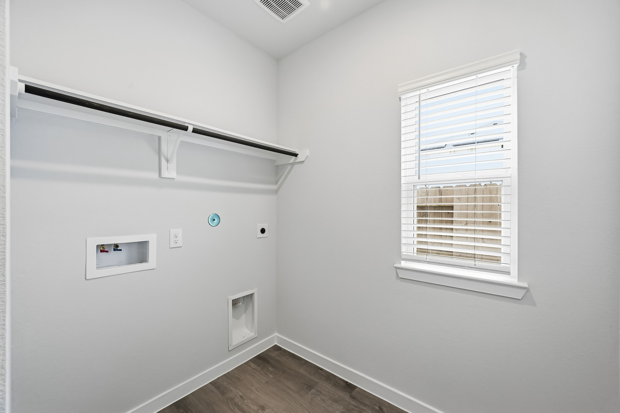 A white room with a window.