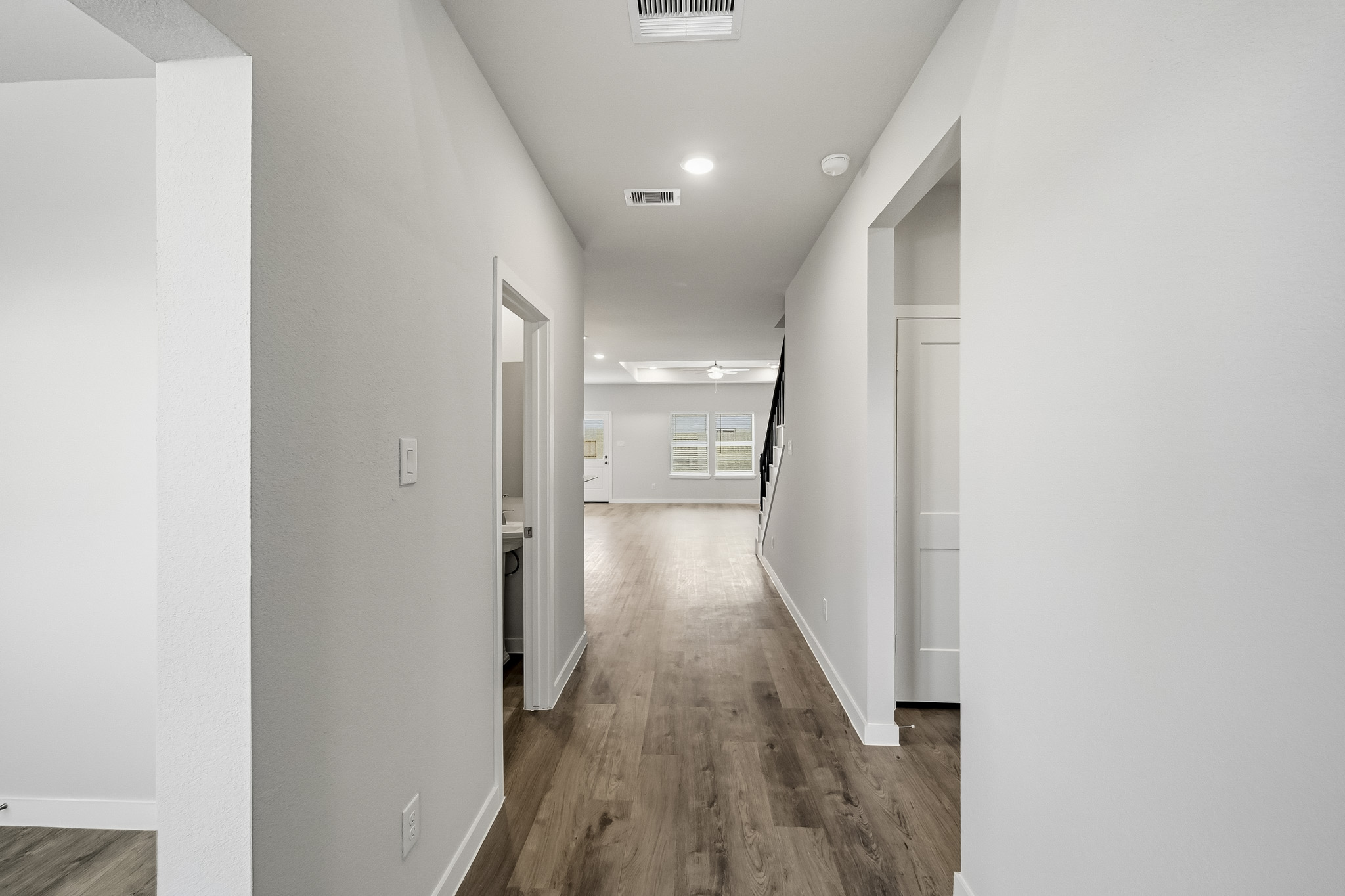 A hallway with white walls.