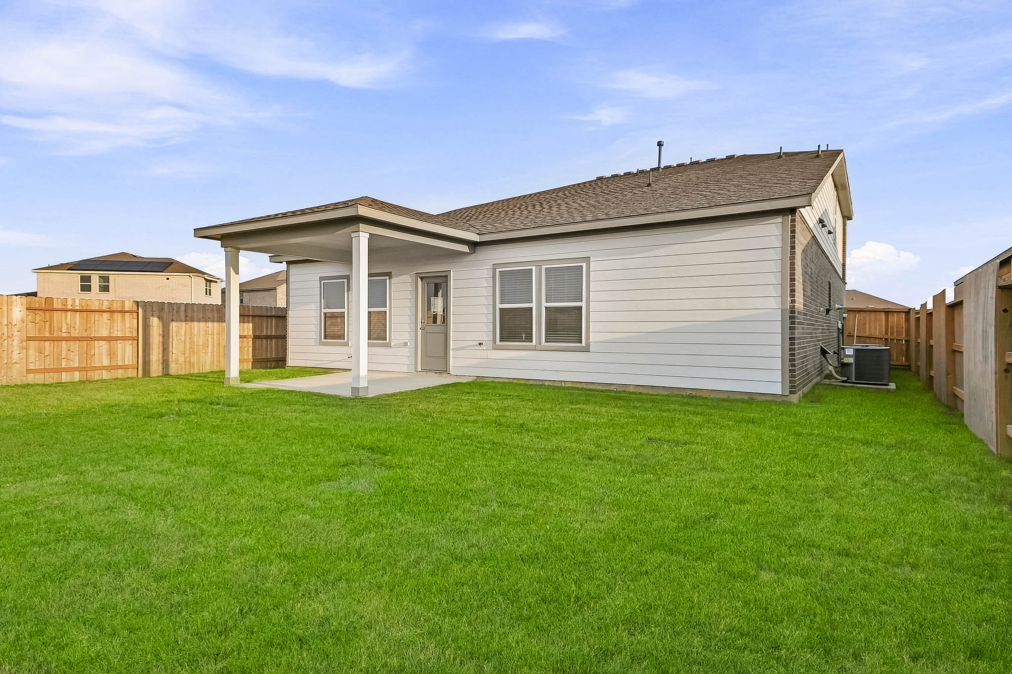A house with a grass yard.