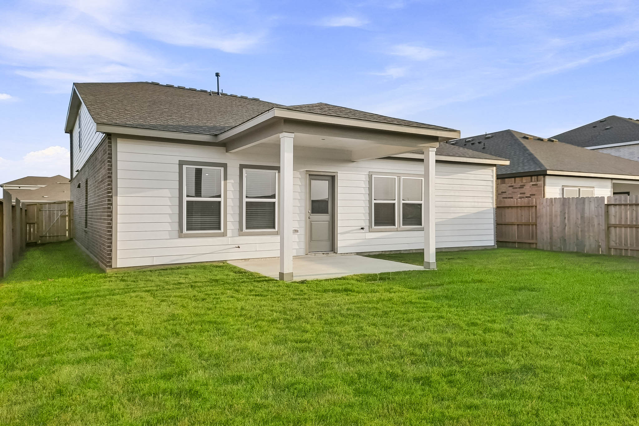 A house with a grass yard.