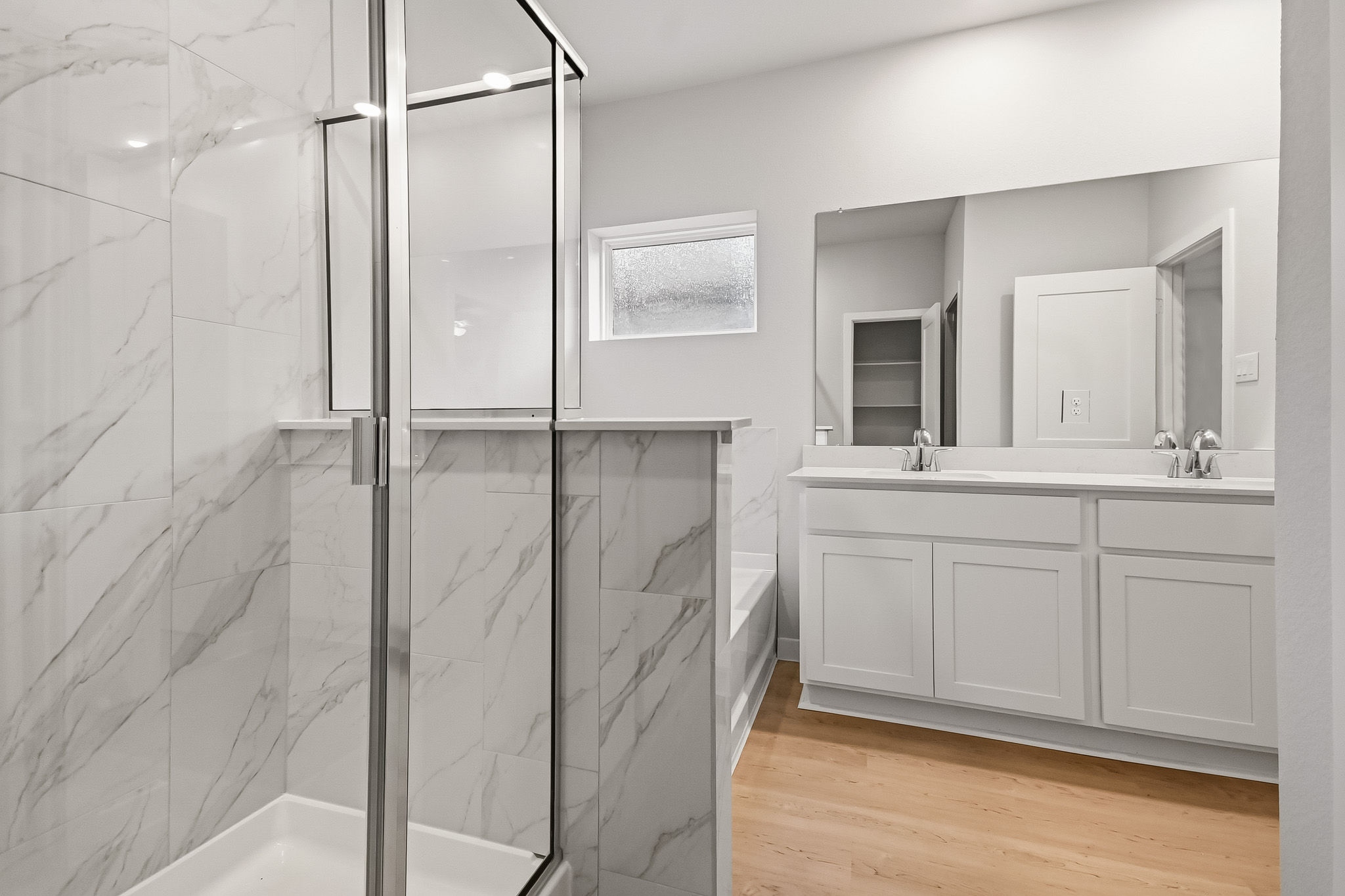 A bathroom with a glass shower.