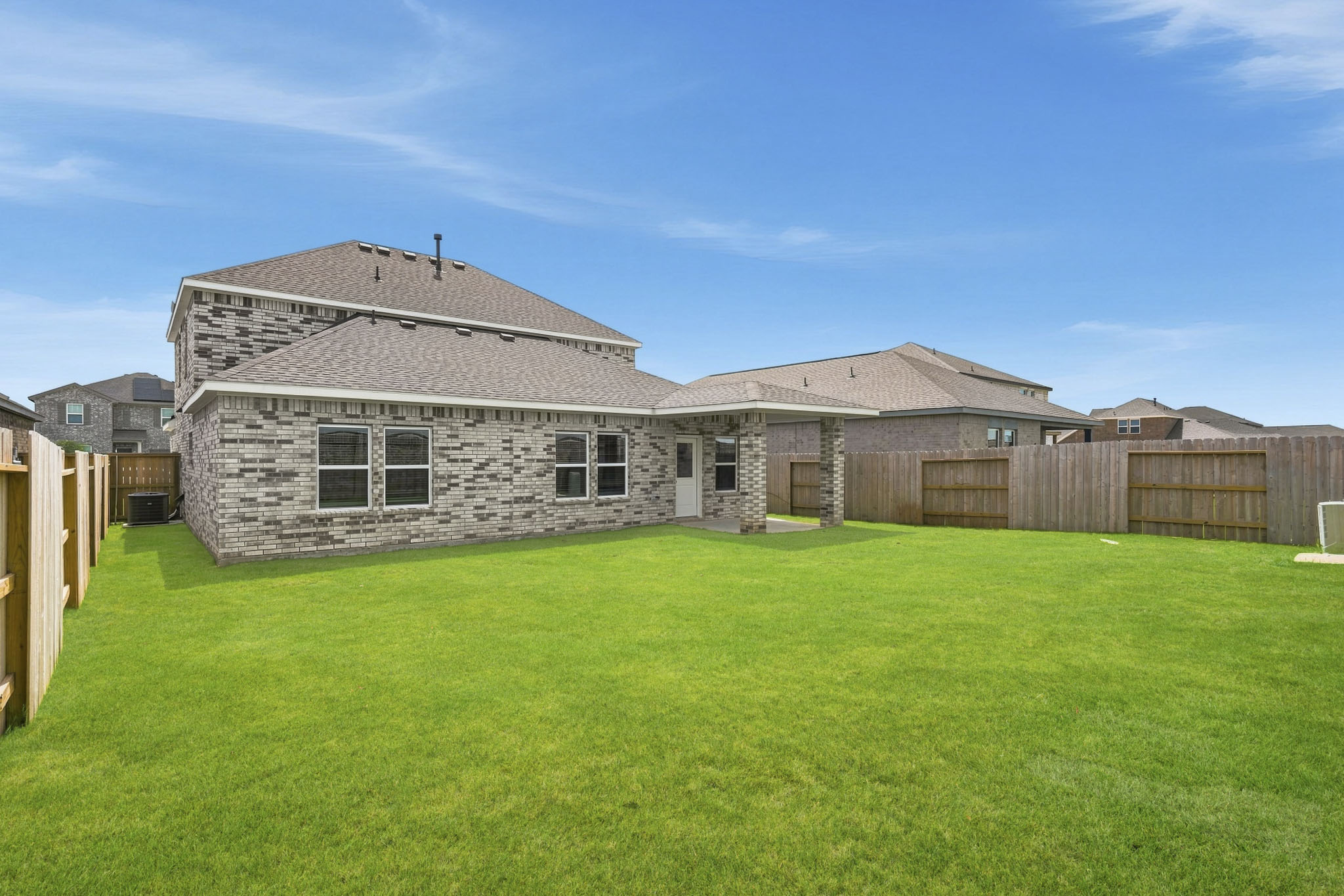 A large house with a fence around it.