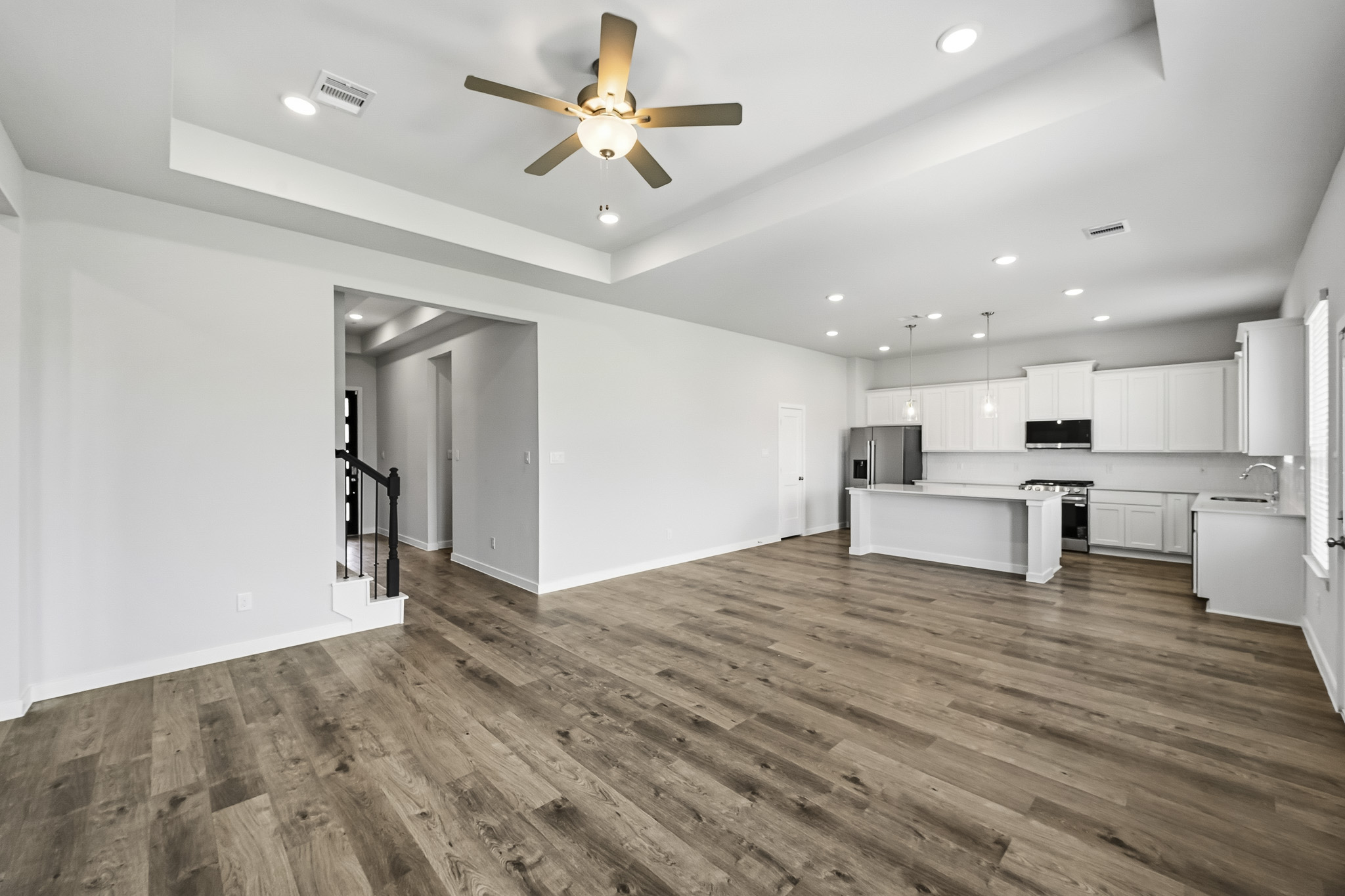 A large kitchen with white cabinets.