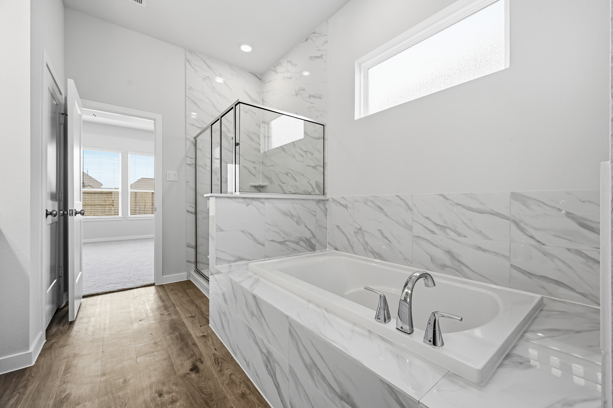 A bathroom with a tub and sink.