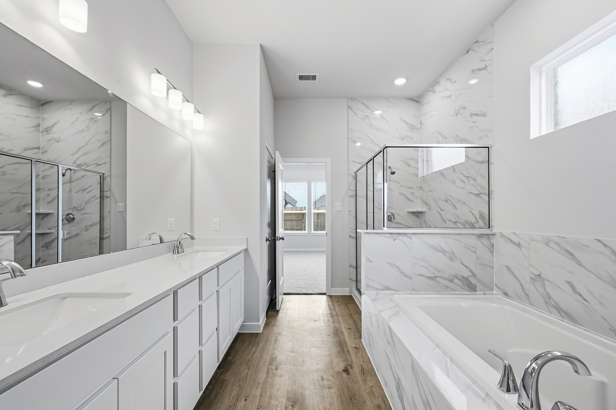 A bathroom with a tub and sink.